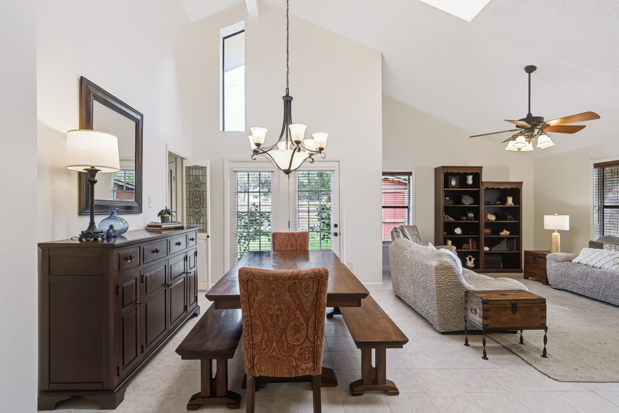 Soaring vaulted ceilings, skylights, and clerestory windows create a bright, open, and airy atmosphere, filling the home with natural light.