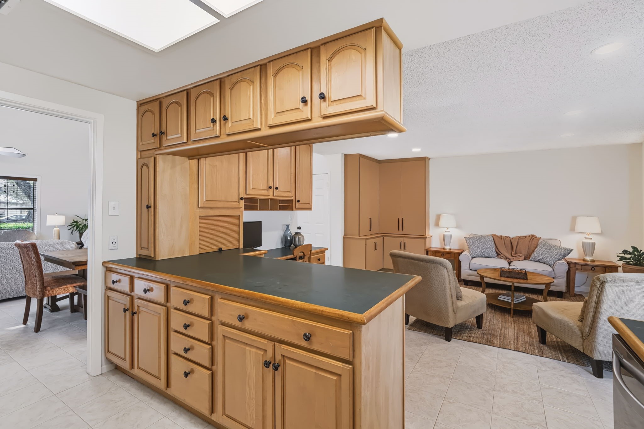 Centrally positioned between the dining room and family room, the kitchen serves as the heart of the home, offering an open, connected layout ideal for everyday living and entertaining.