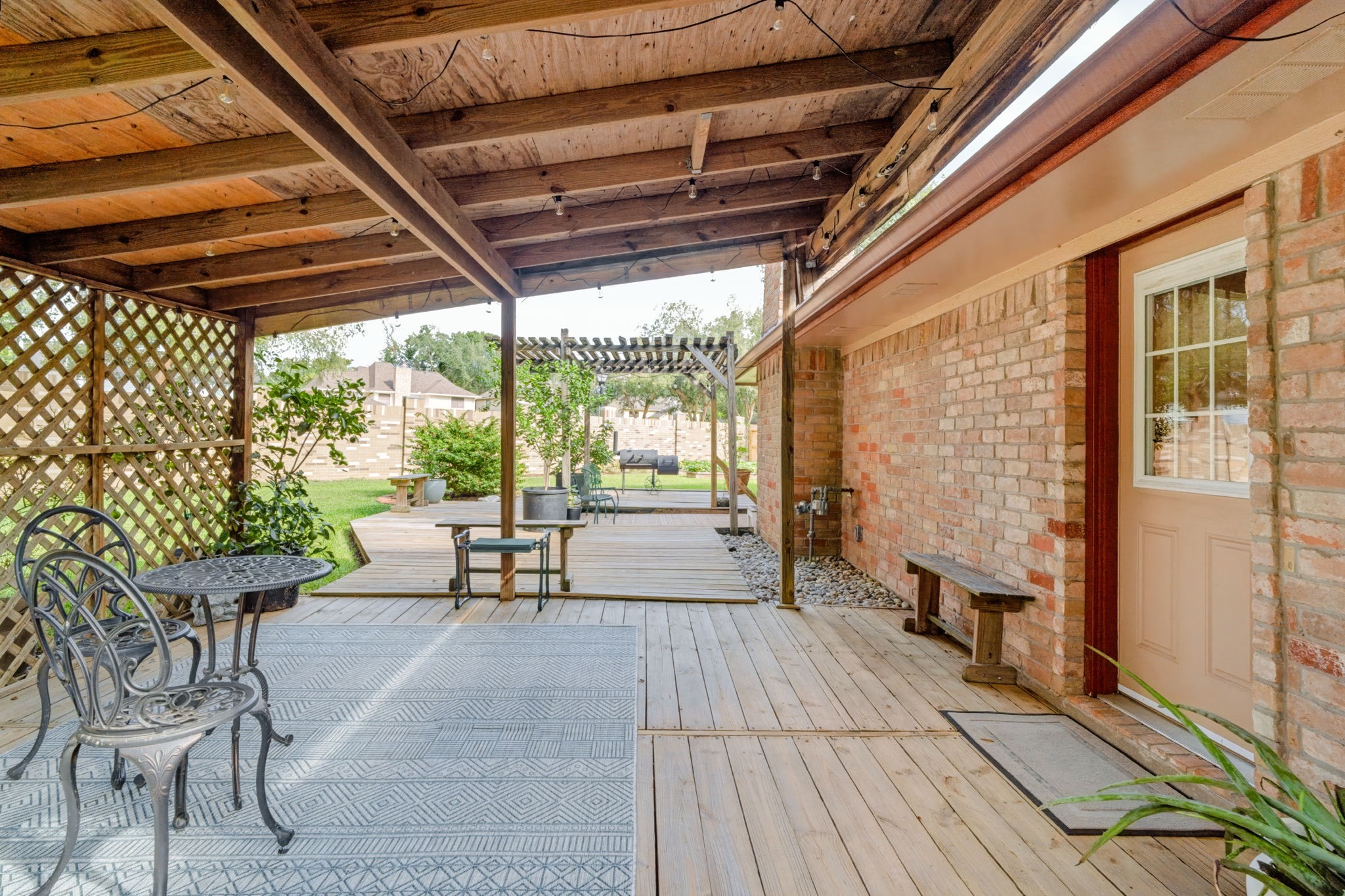 Step outside to enjoy the covered patio overlooking the beautifully landscaped backyard and side yard.