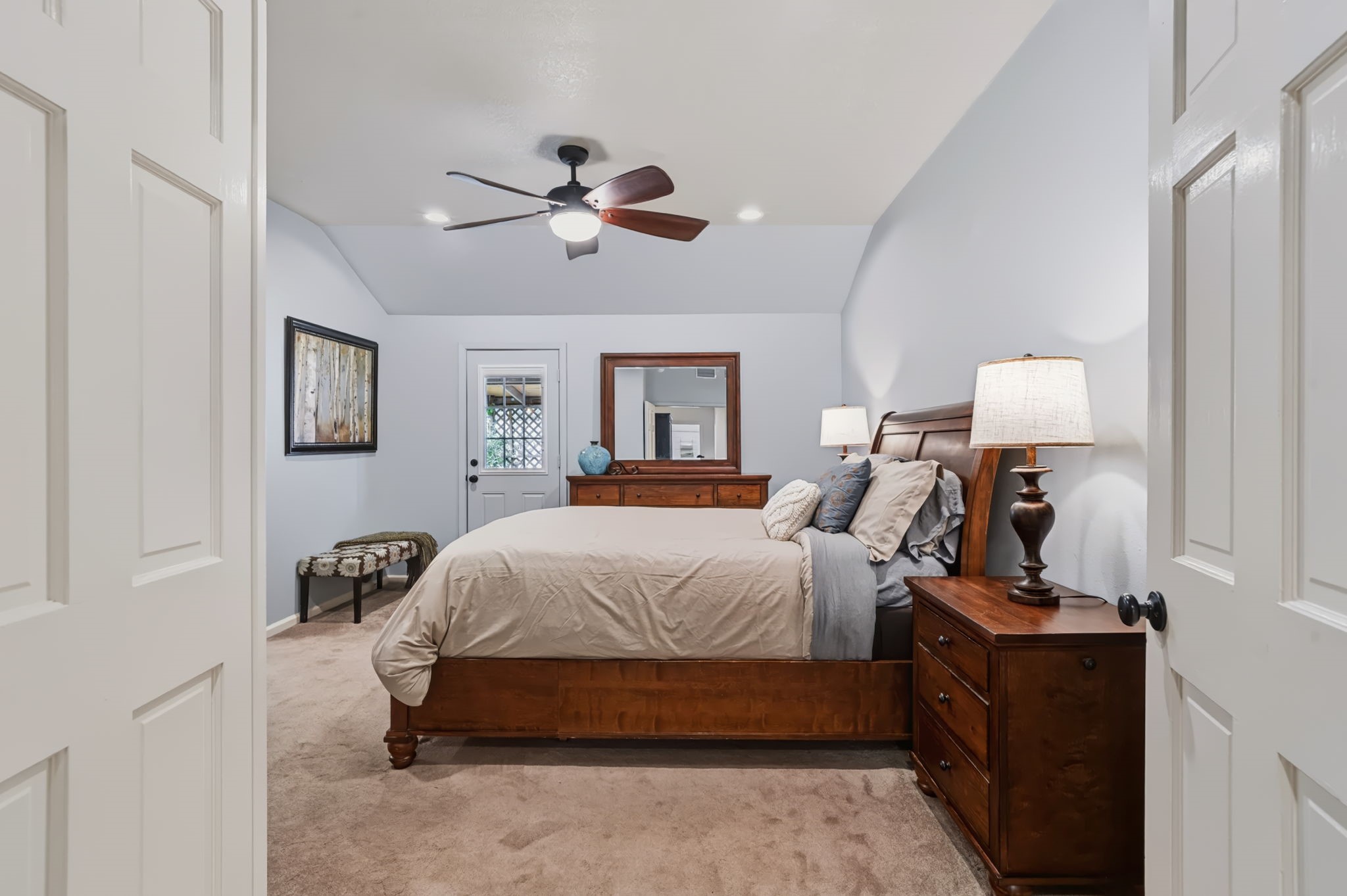 The spacious 17 x 13 primary bedroom features a door leading to the patio, creating a lovely connection to the outdoors, along with a private en suite bathroom.