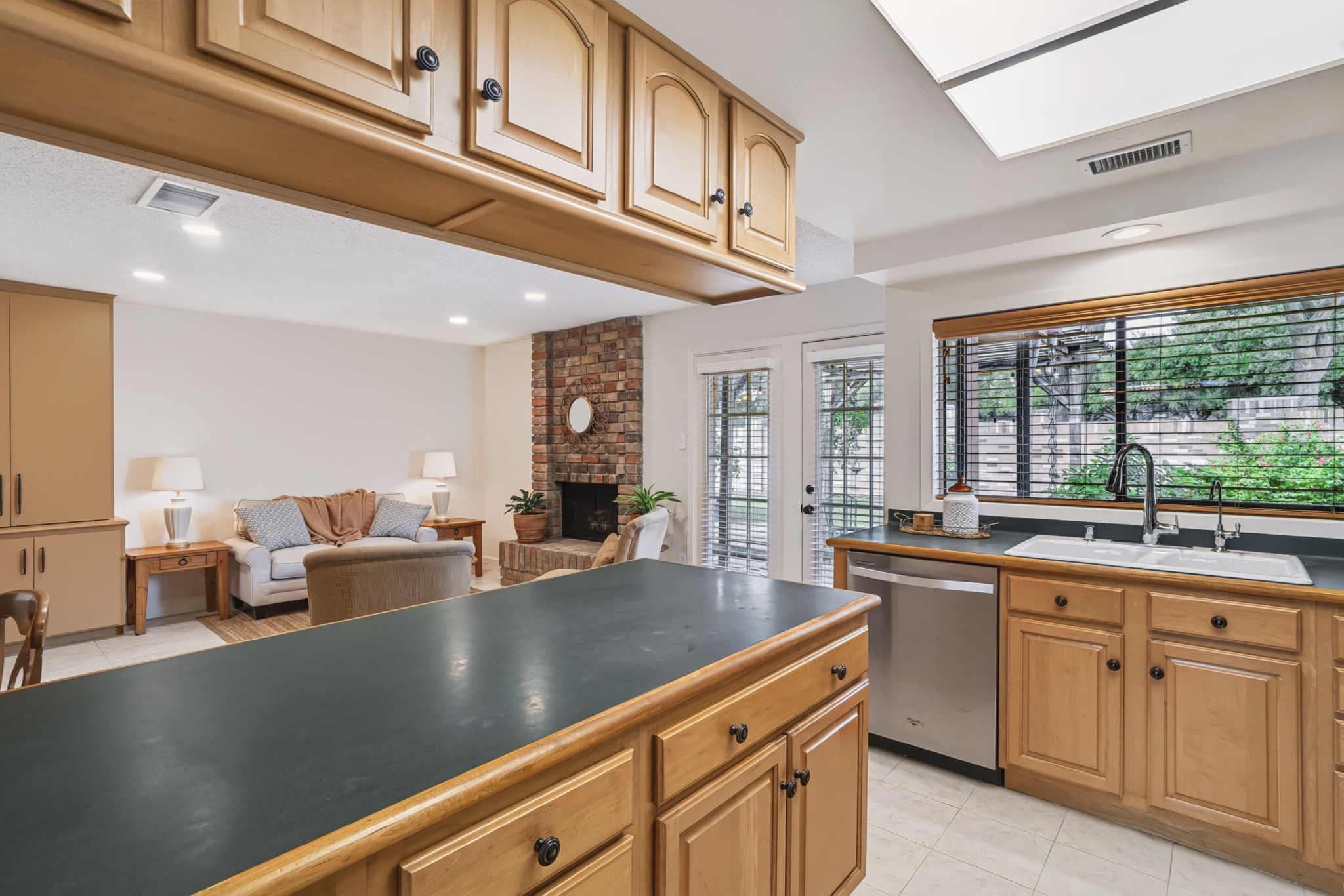 Ample countertop workspace and cabinetry provide plenty of room for meal prep, storage, and keeping everything organized.