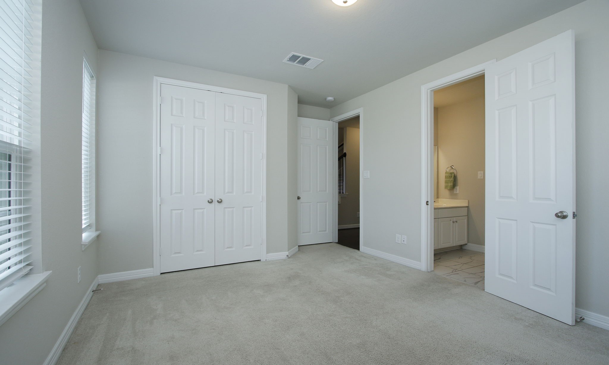 Bathroom is between the two bedrooms on the first floor