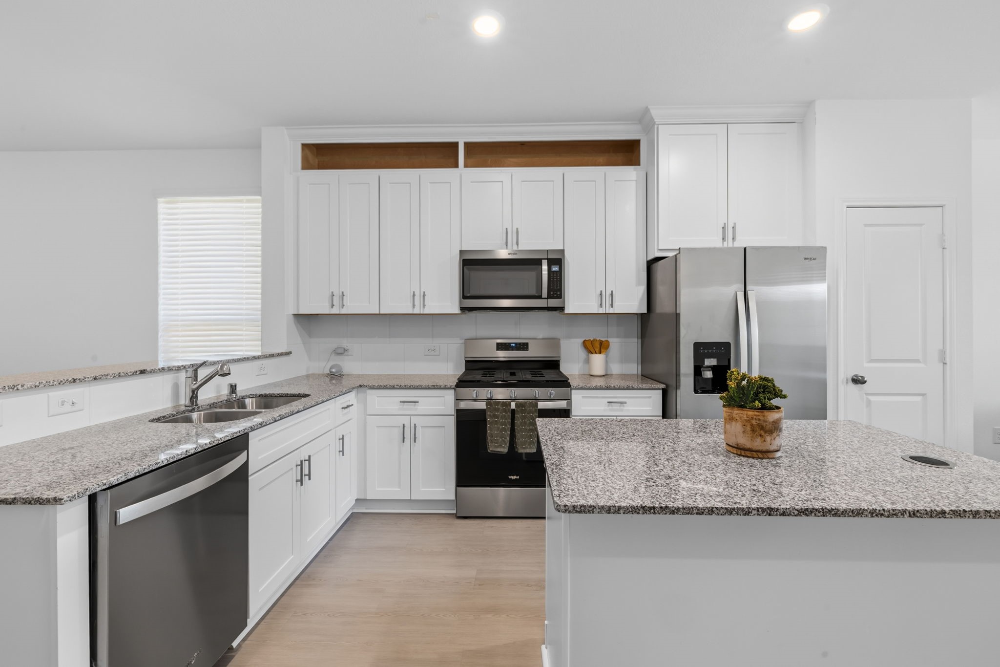 Beautiful kitchen space with an island and breakfast bar.