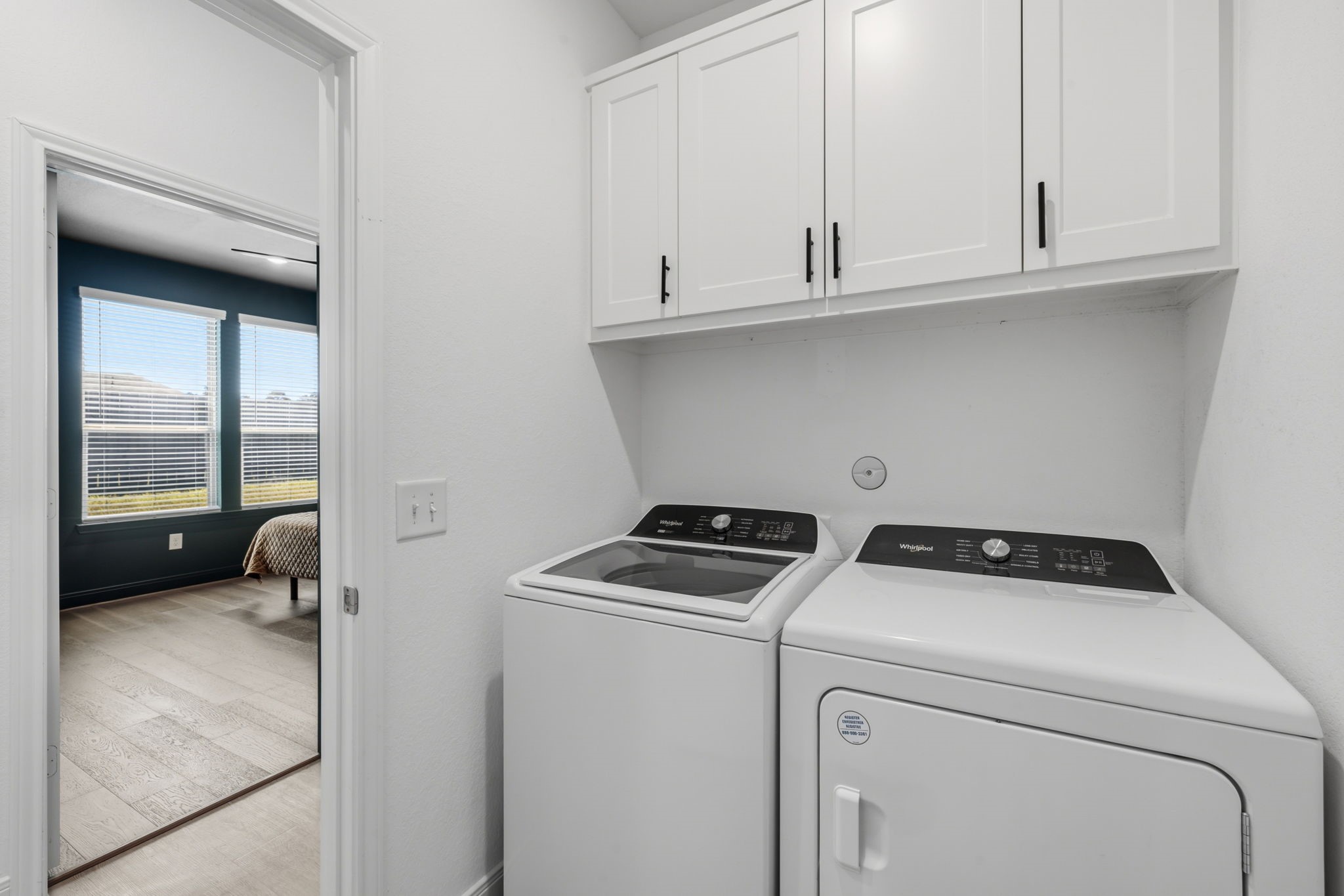 LAUNDRY ROOM: located across from the primary bedroom