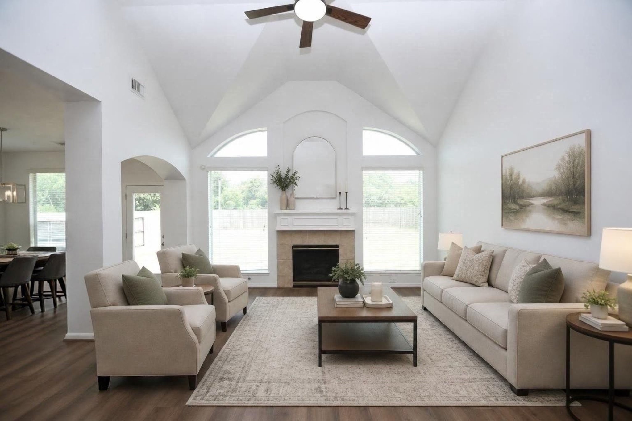 Experience the inviting charm of this virtually staged living space, boasting high ceilings, abundant natural light, and elegant furnishings that create a perfect blend of comfort and sophistication.