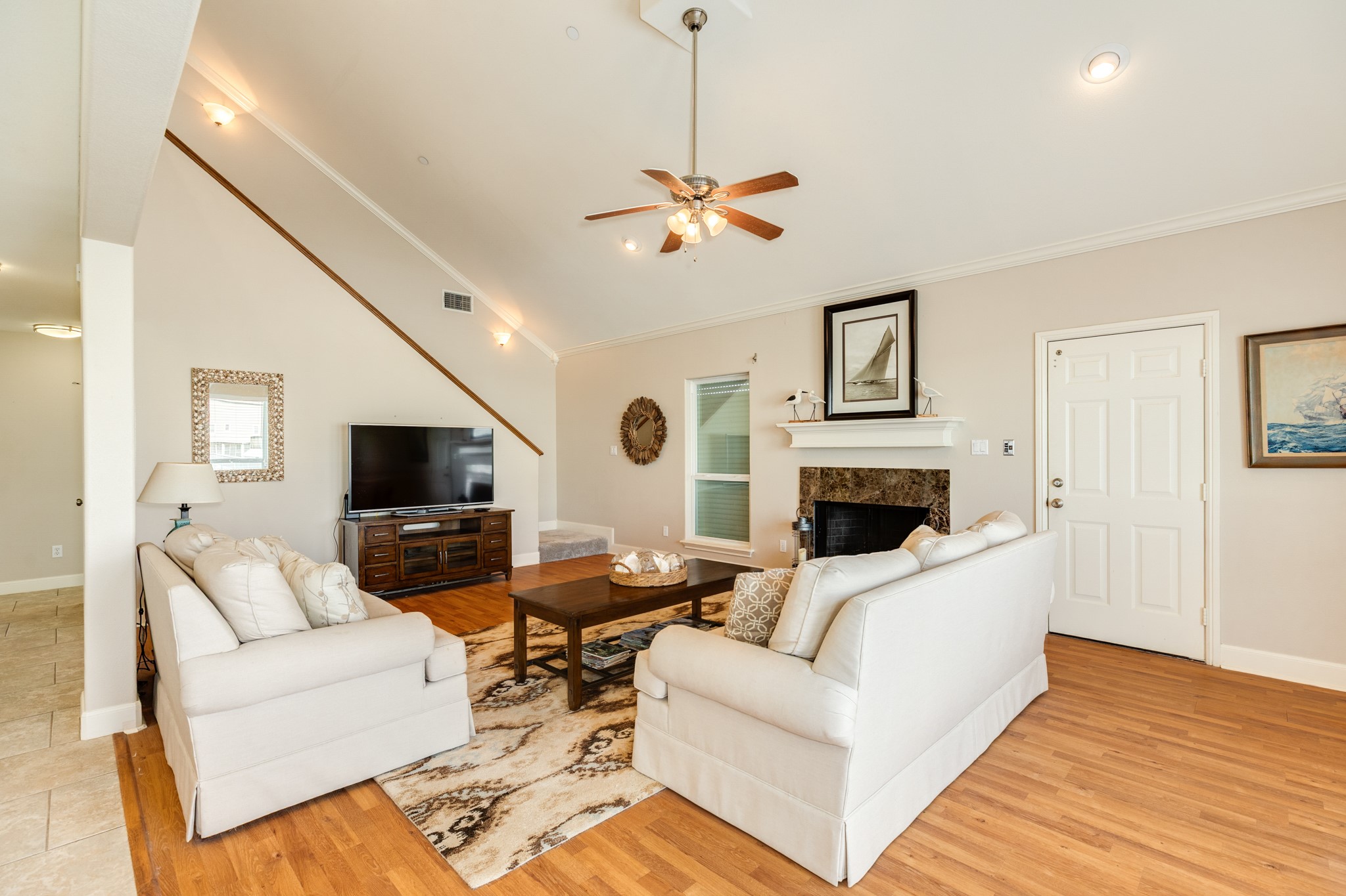 Door in view next to the fireplace, is the elevator. Nice spacious living room for when you need a break from the outdoors.