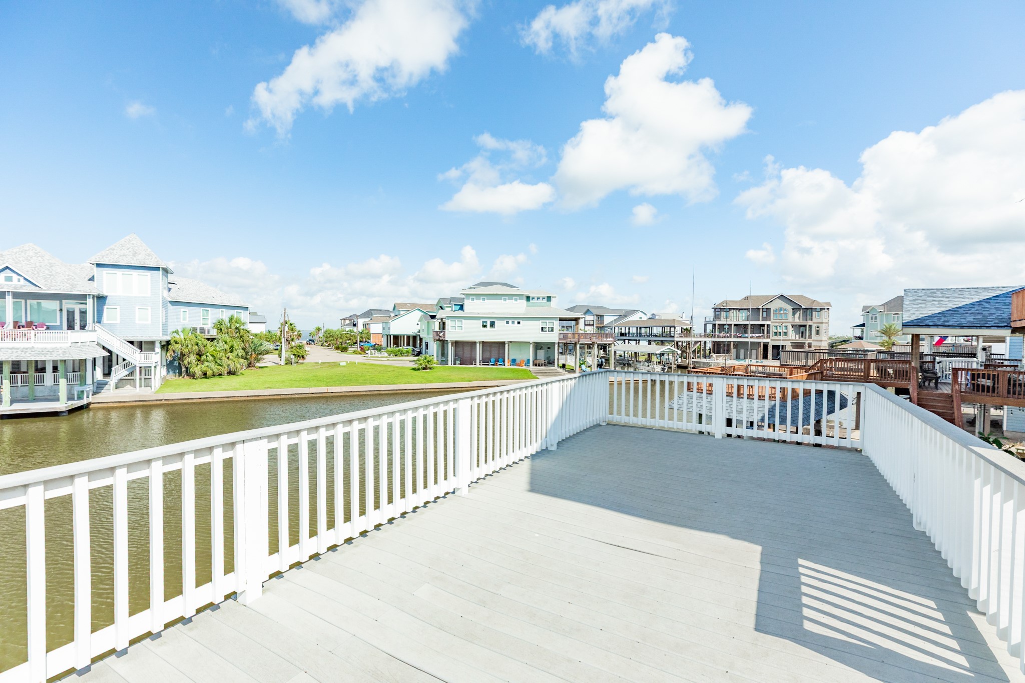 Another view of the boat house deck, nice space between you and your neighbor's property at this home.