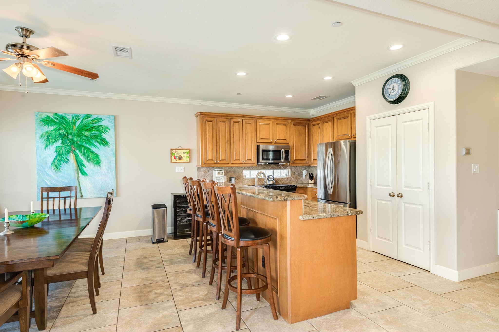 Four person breakfast bar, pantry and galley kitchen are well organized in this home.