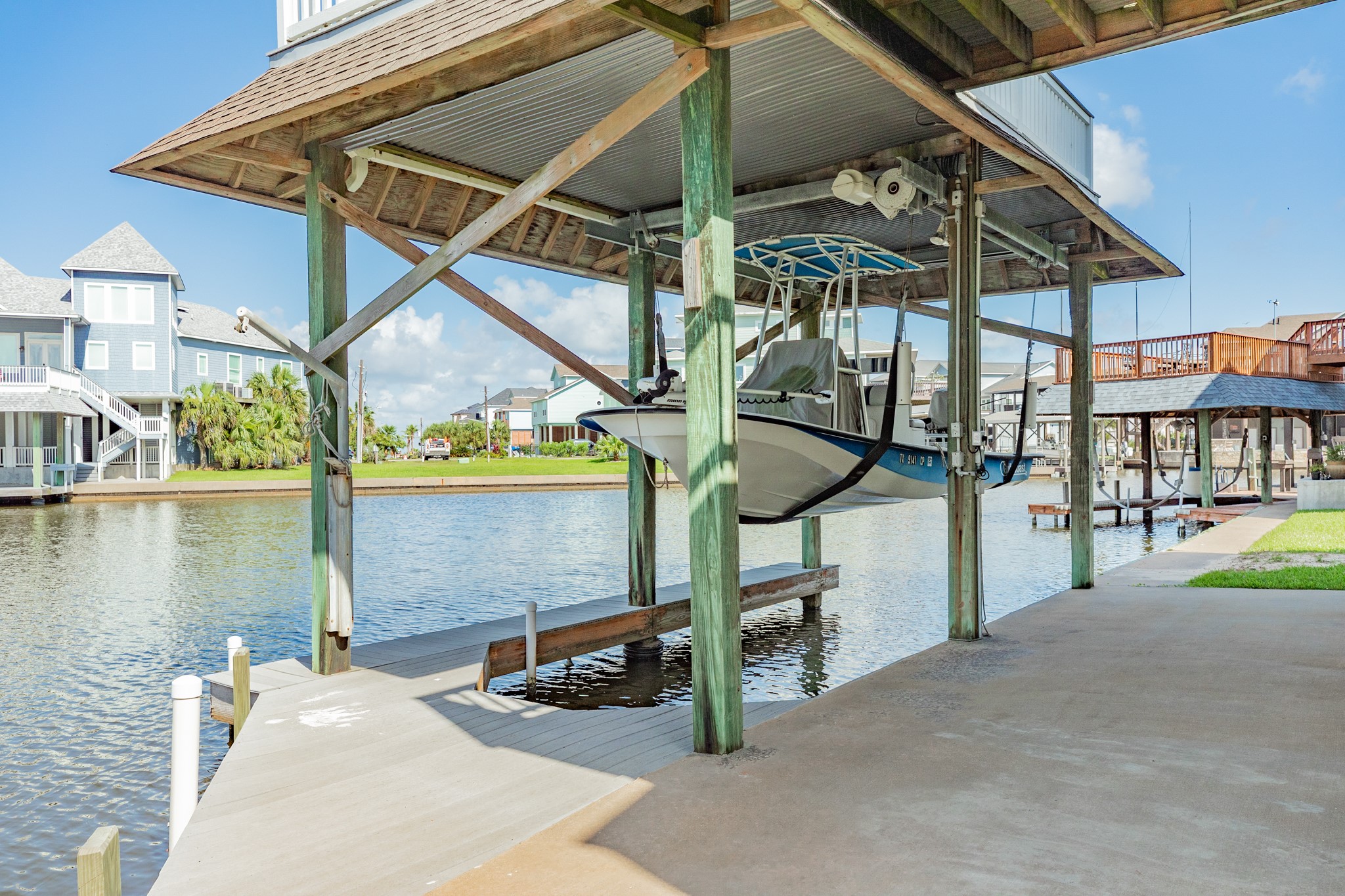 Boat slip & lift allows you to get your boat, with fixed Bimini top, out of the water with plenty of room for when those high tides come in.