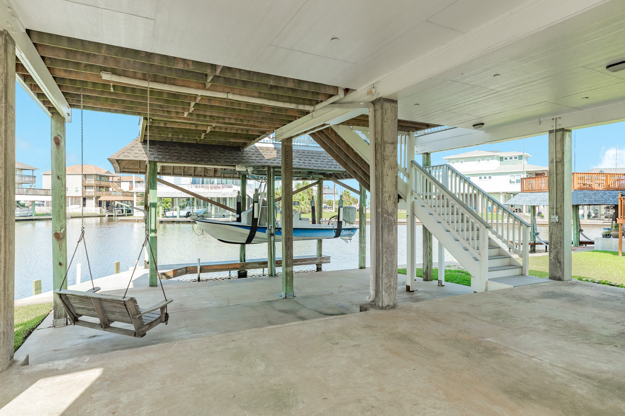 Multi level concrete patio area leading down to the boat slip, Perfect place for outdoor tiki bar, hot tub, and ground floor bbq center!