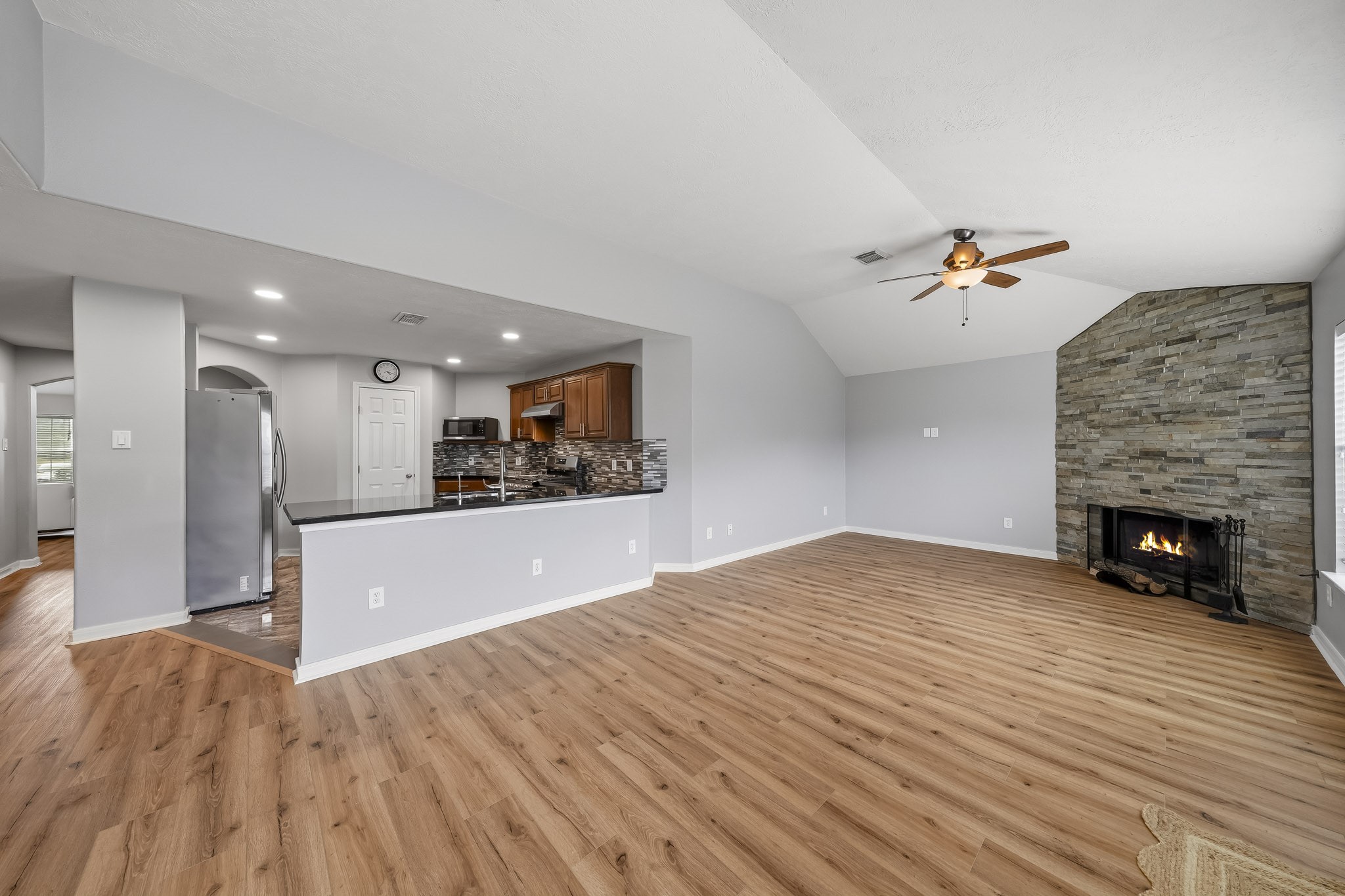 Open-concept layout provides flexible space for both family area and dining.