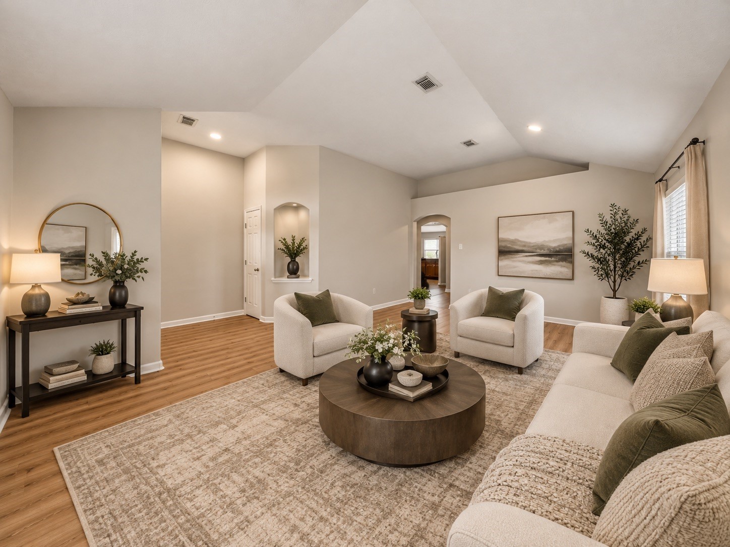 Spacious virtually staged family area offers warm flooring, a high ceiling, and plenty of natural light.