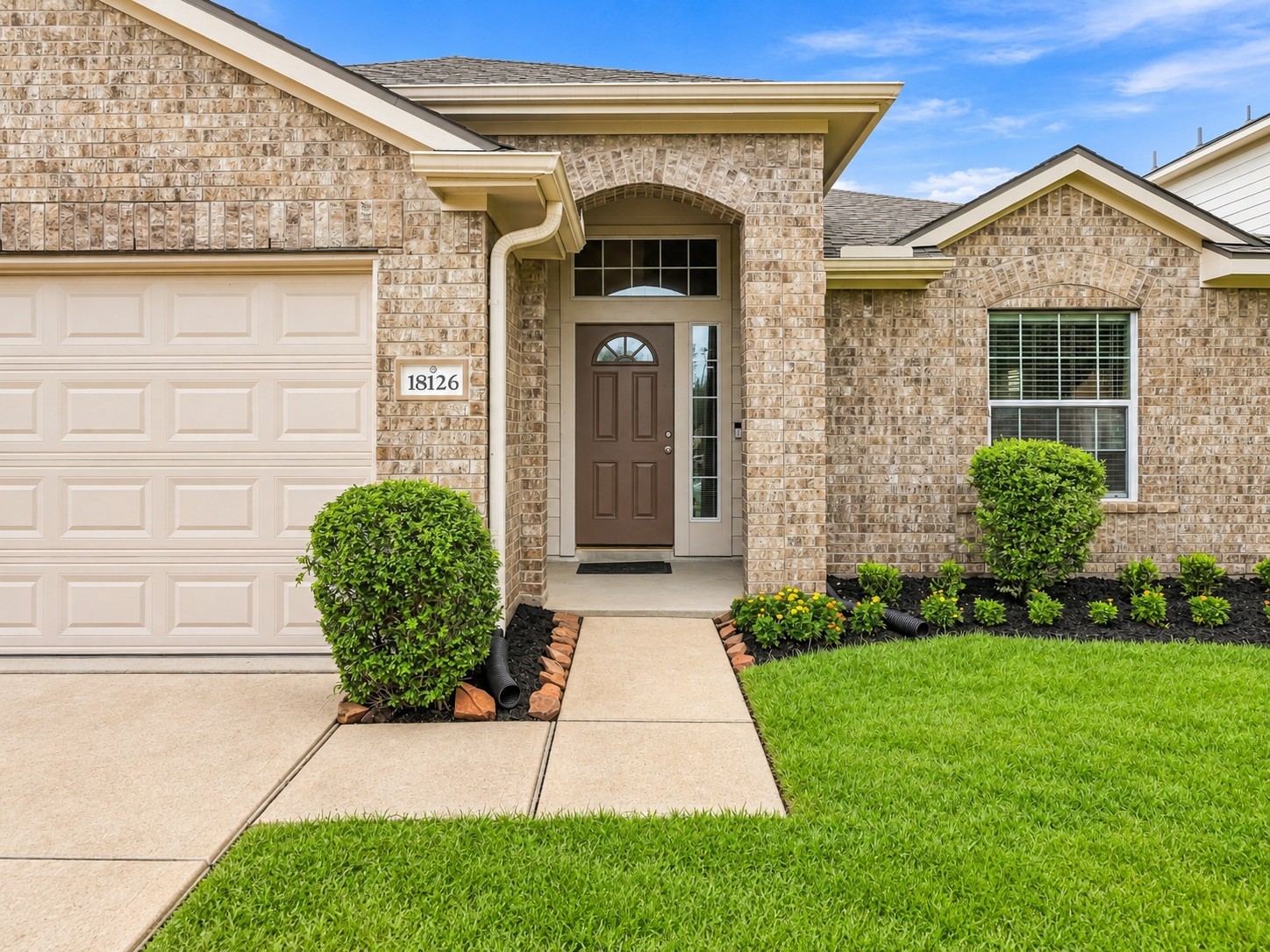 Covered front entry creates a warm and inviting welcome.