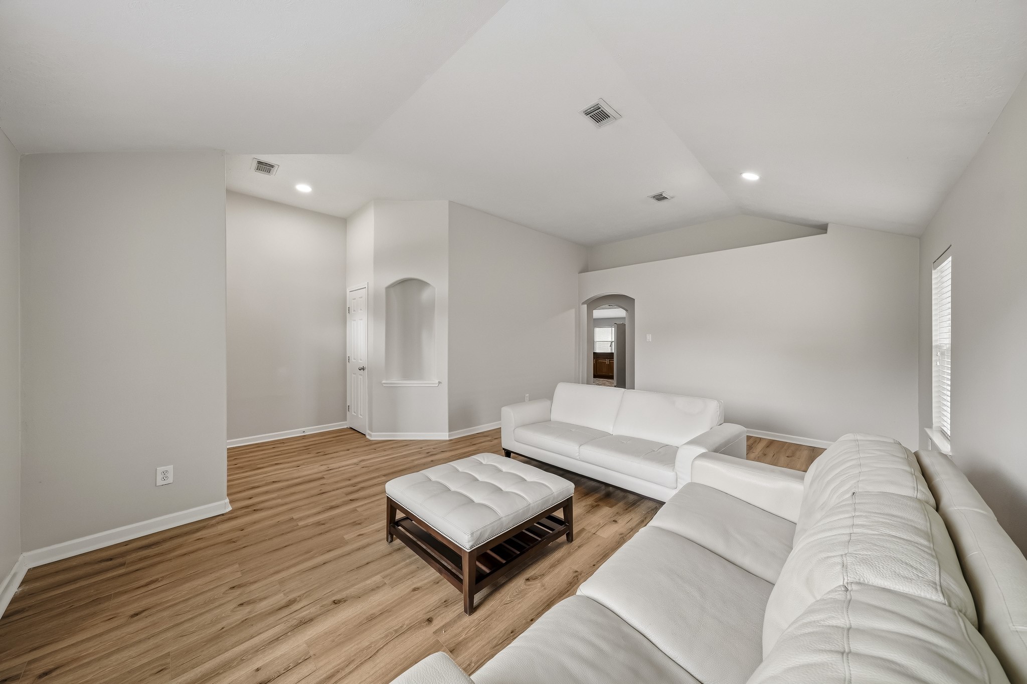 Flex area offers additional space for lounging, working, or entertaining.
