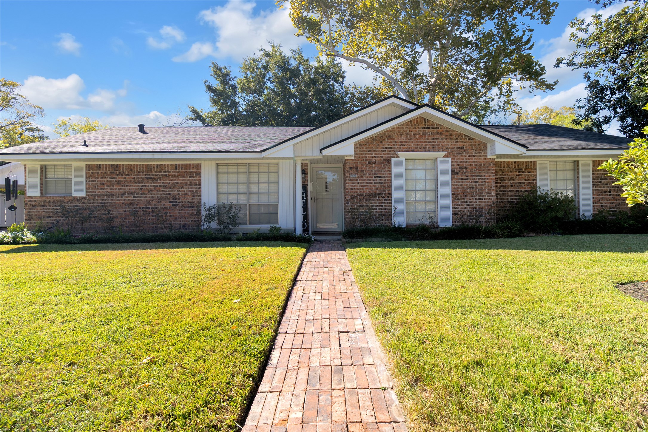 Inviting front entrance featuring a welcoming walkway surrounded by beautifully maintained landscaping, enhancing the homes charming curb appeal. Inviting front entrance featuring a welcoming walkway surrounded by beautifully maintained landscaping, enhancing the homes charming curb appeal.