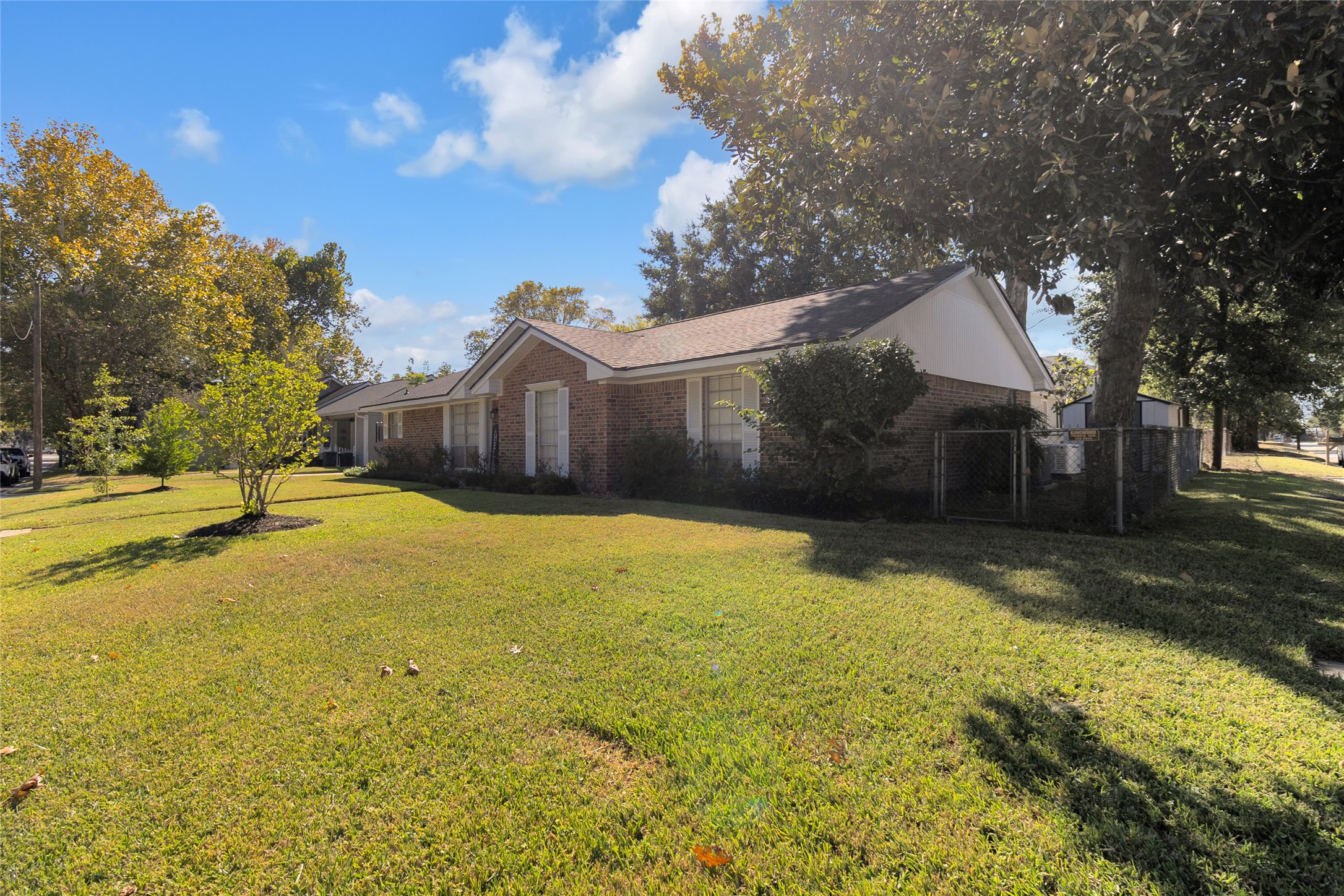 Closer view of this charming corner lot home, surrounded by mature trees that provide abundant shade and enhance the propertys natural beauty. Closer view of this charming corner lot home, surrounded by mature trees that provide abundant shade and enhance the propertys natural beauty.