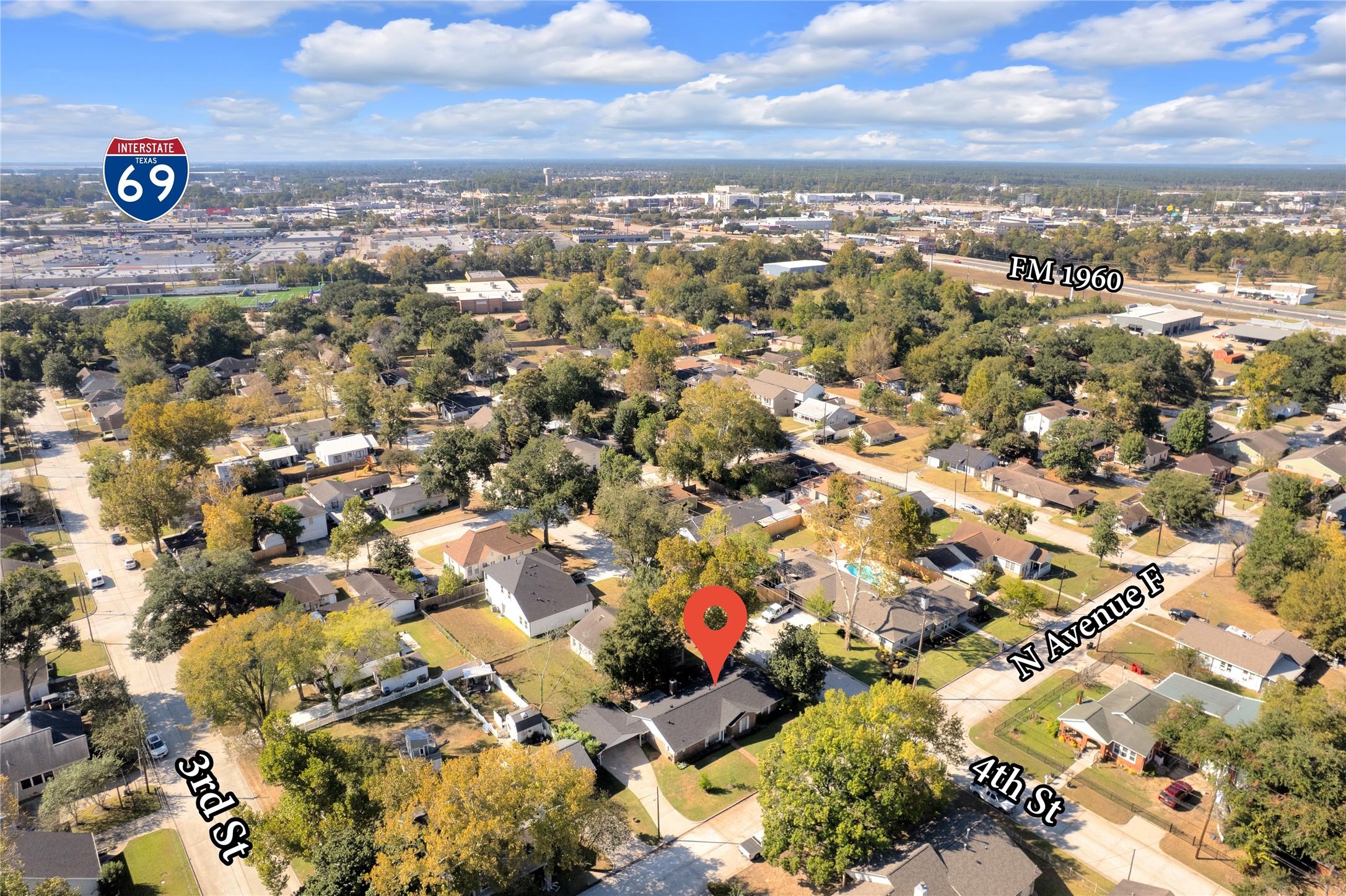 Charming neighborhood setting with convenient access to Interstate 69 and FM 1960, offering a blend of suburban tranquility and urban connectivity.
