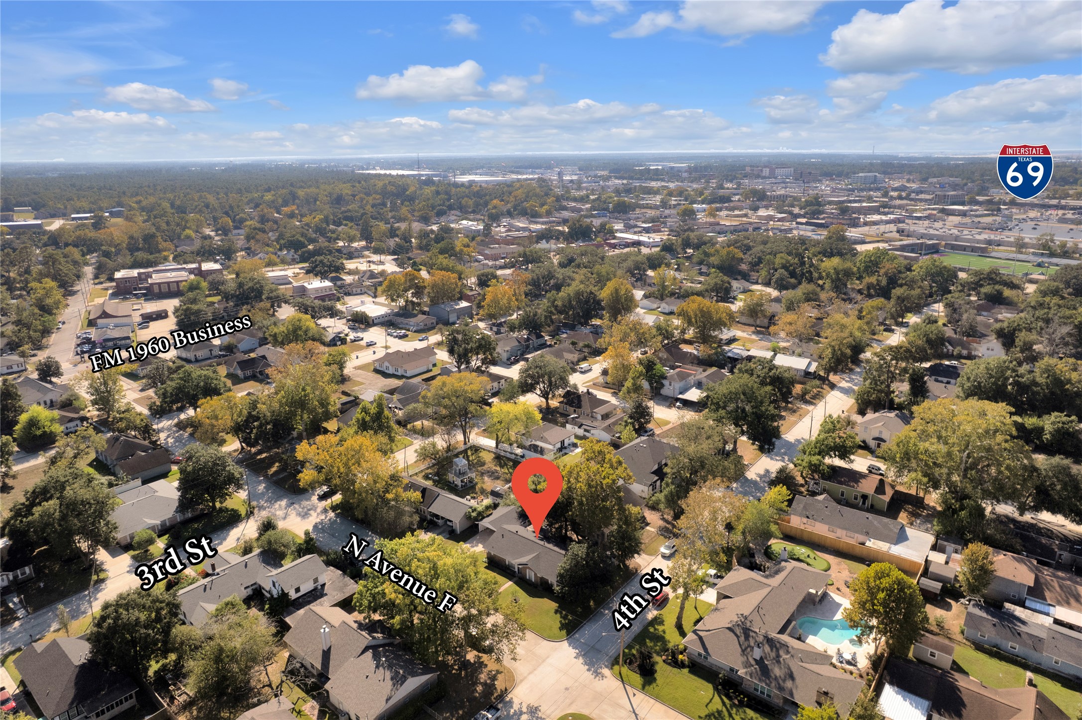 Centrally located home in a charming neighborhood with easy access to FM 1960 Business and Interstate 69, offering convenience and connectivity.