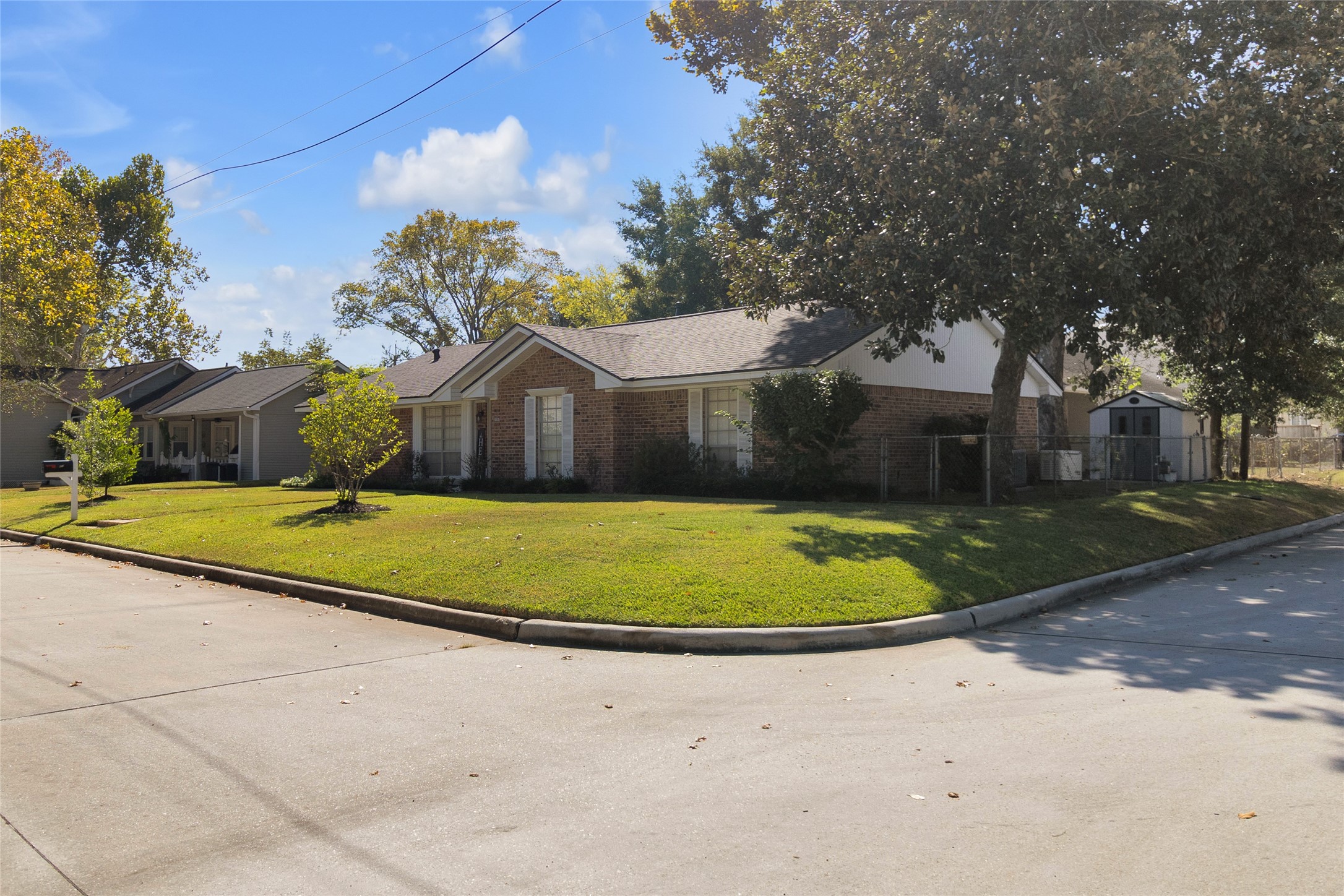 Beautiful view of this spacious corner-lot property, showcasing its inviting curb appeal and expansive outdoor space. Beautiful view of this spacious corner-lot property, showcasing its inviting curb appeal and expansive outdoor space.