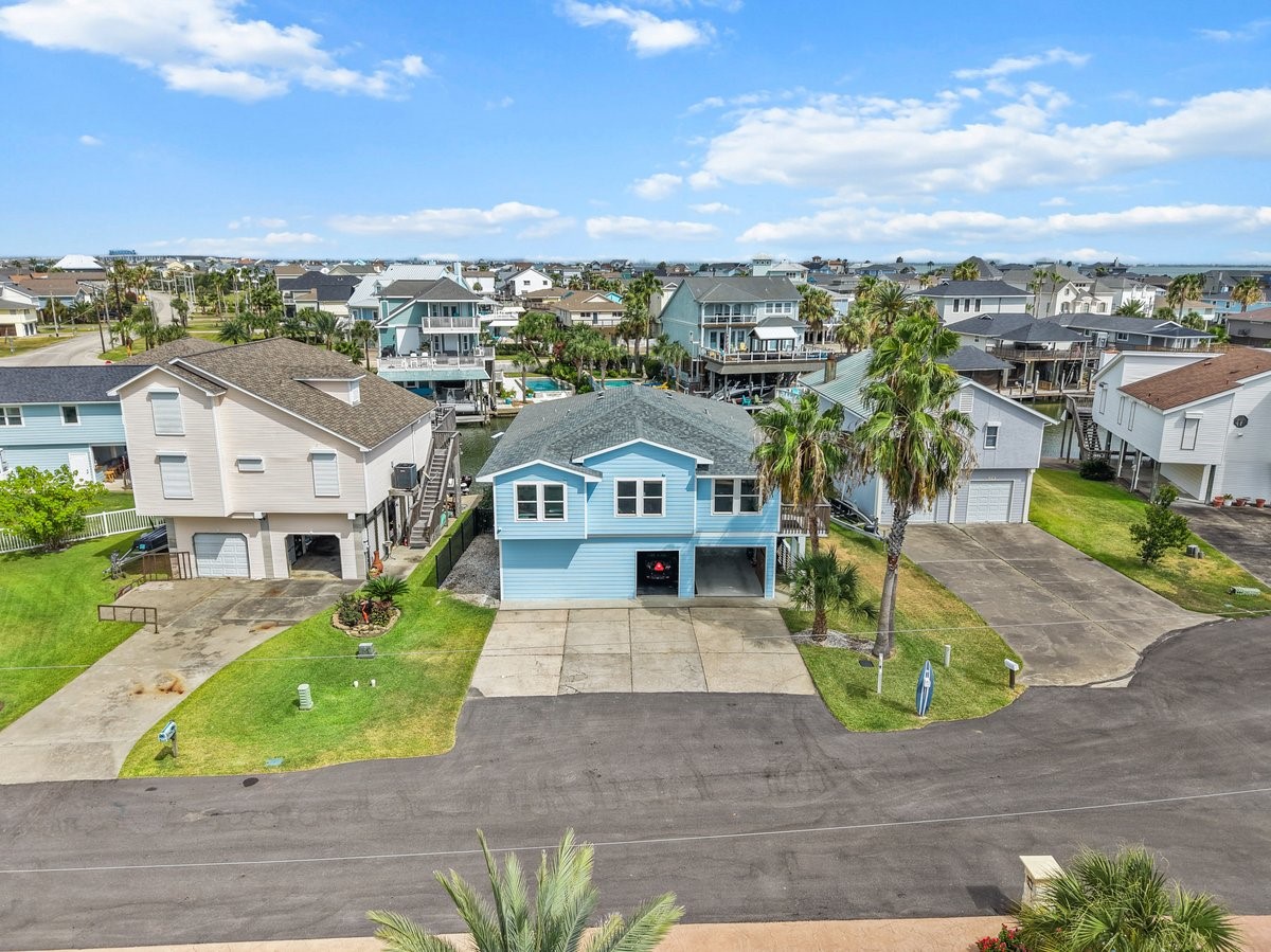 Welcome to your Bright and Breezy Coastal Retreat! Stunning Coastal Blue Stilt-Home stands out with its fresh Modern Exterior! Welcome to your Bright and Breezy Coastal Retreat! Stunning Coastal Blue Stilt-Home stands out with its fresh Modern Exterior!