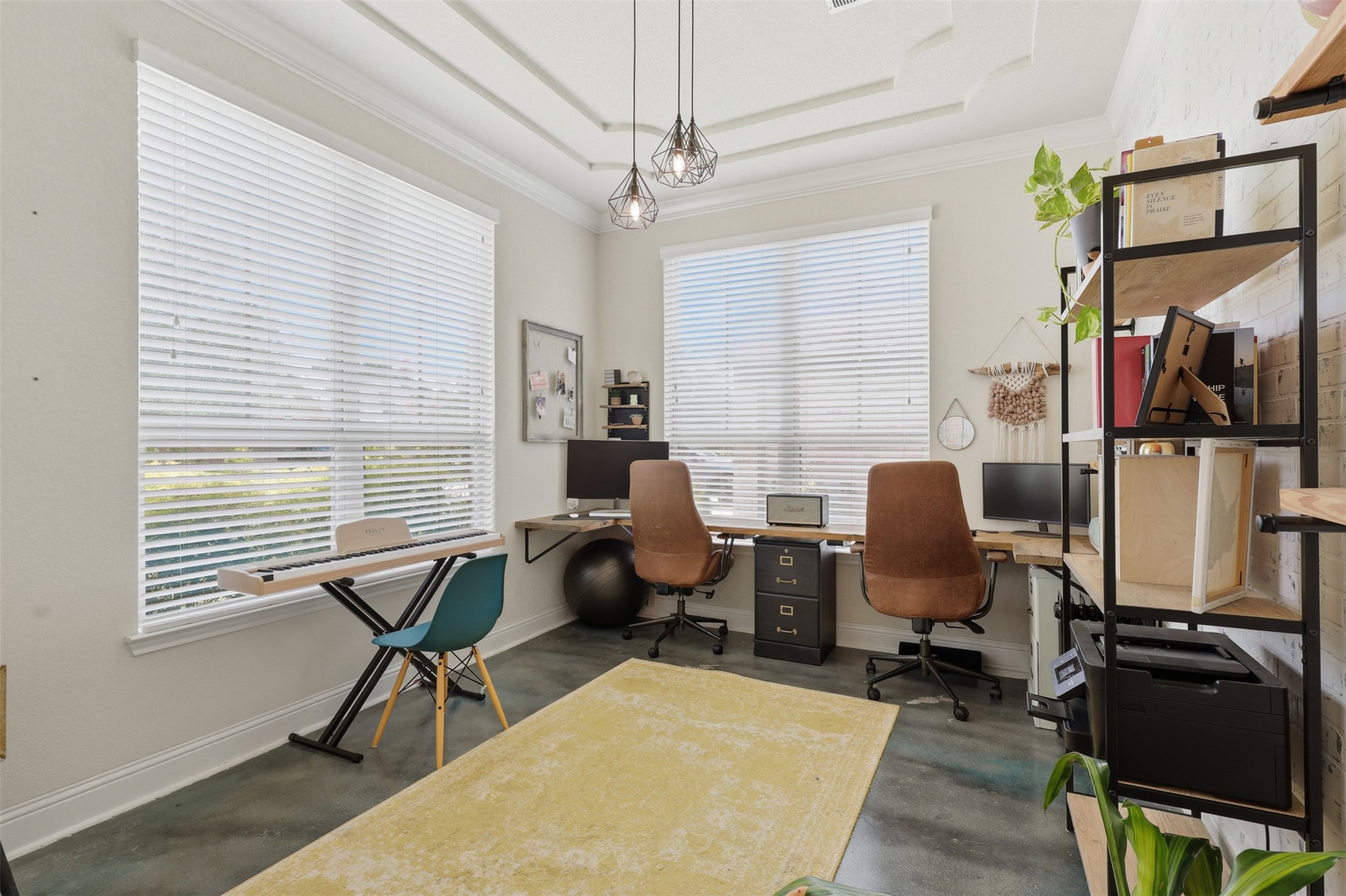 Private home office with large windows and abundant natural light.