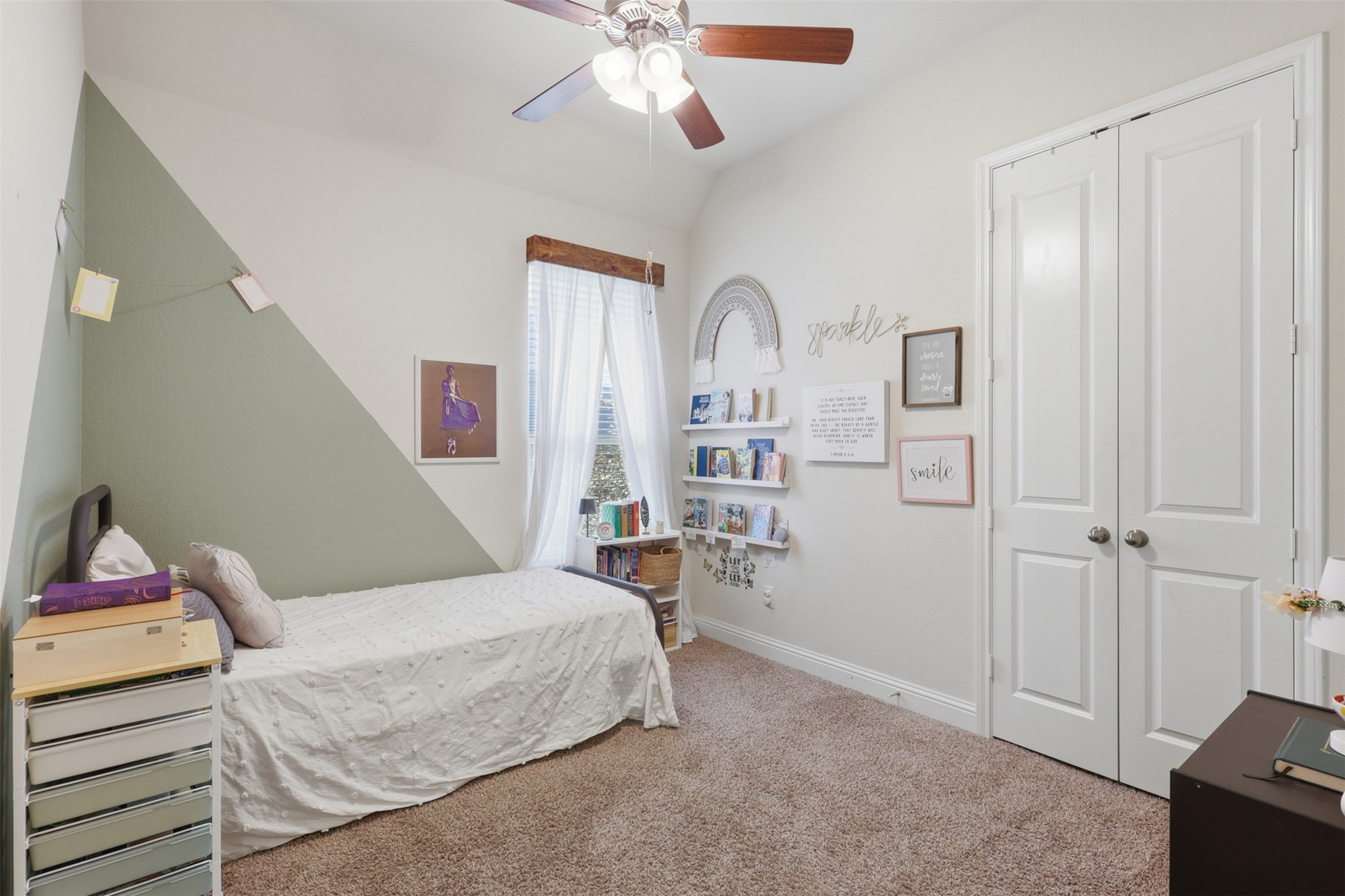 This is a spacious secondary bedroom with large closet.