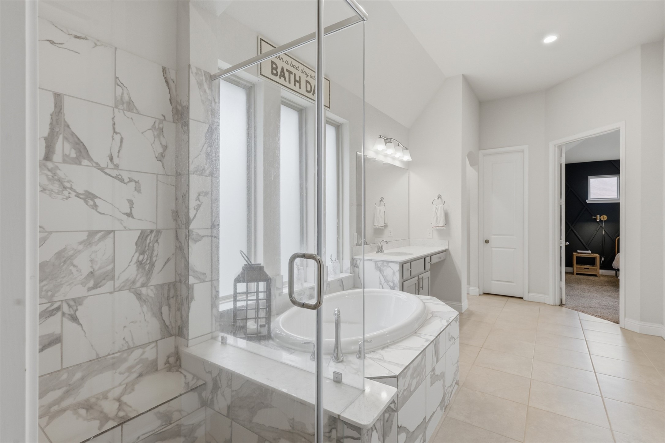 Luxurious primary bath with oversized walk-in shower.
