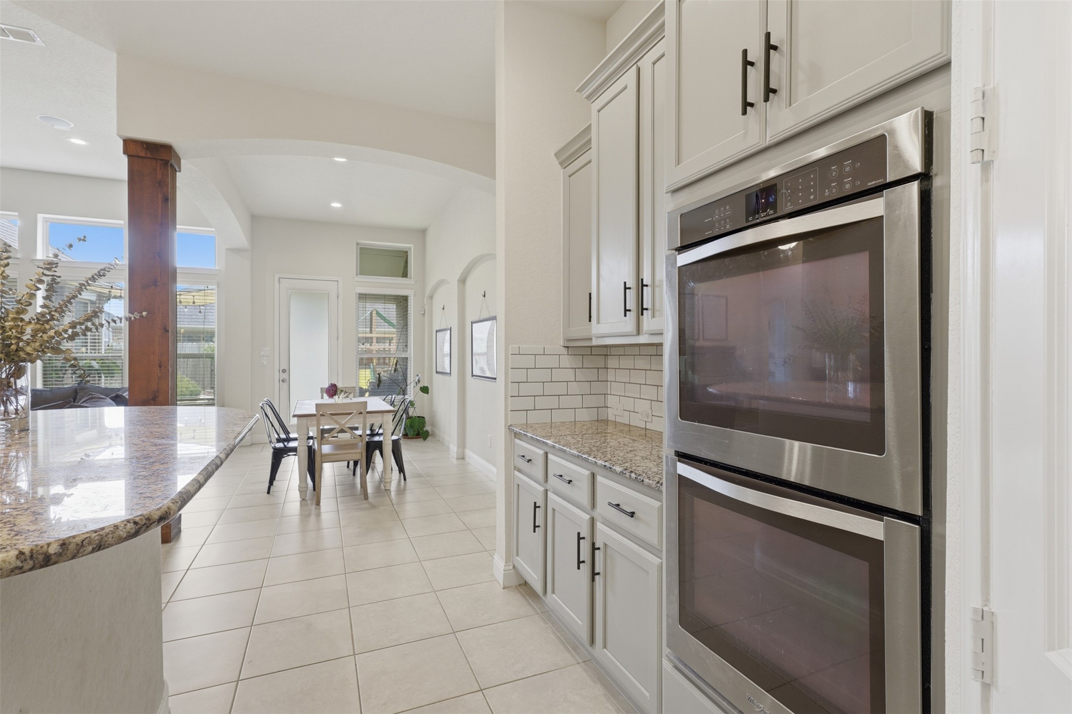 Built-in double ovens and ample cabinet storage.