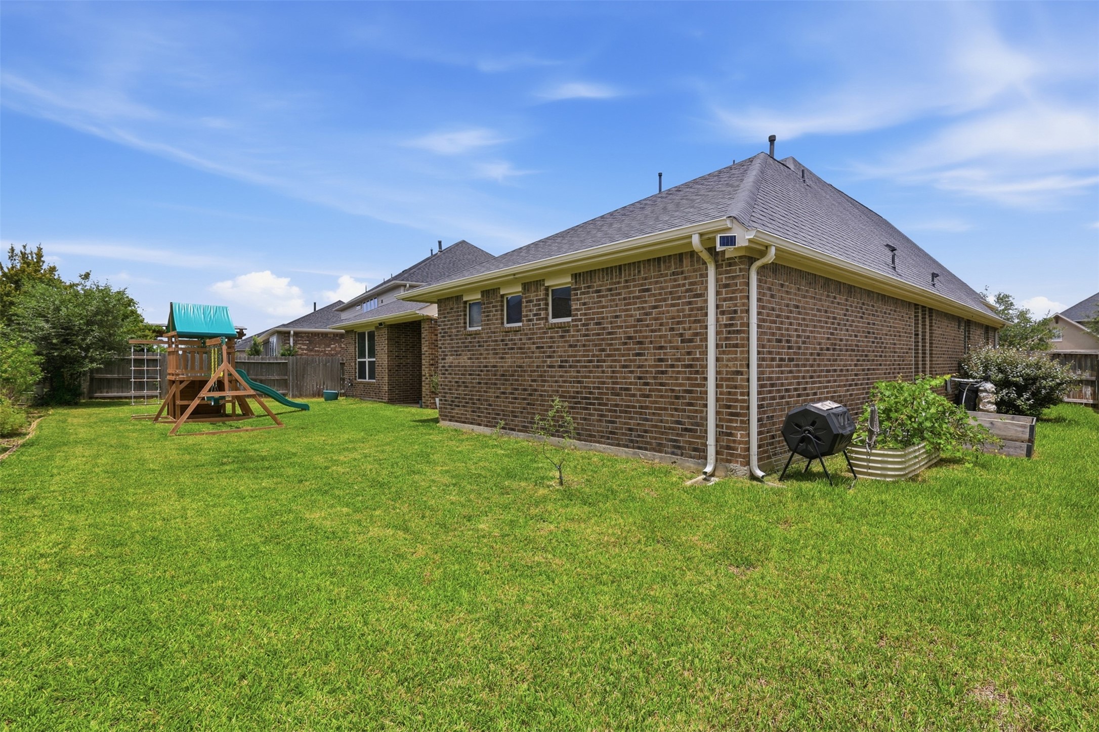 Large fully fenced backyard with plenty of room to play.