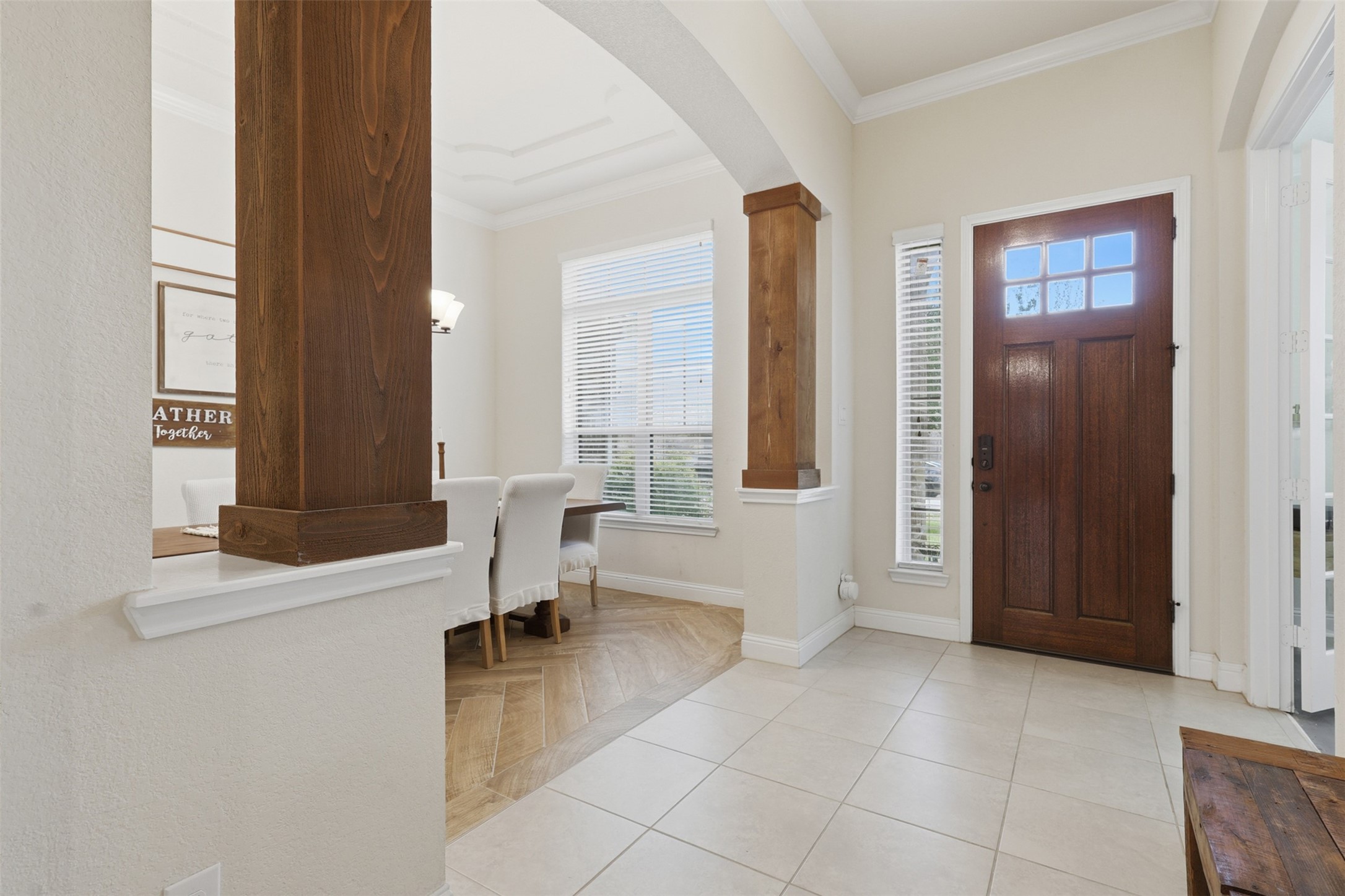 Bright entry foyer with soaring ceilings and architectural details.