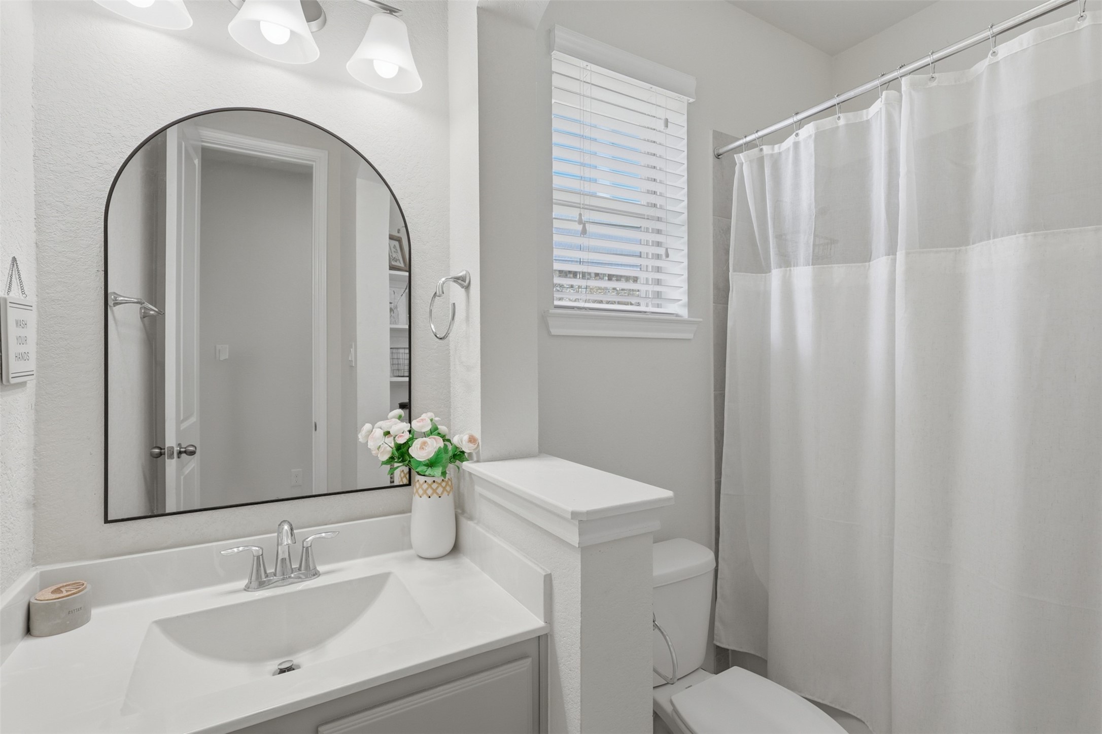 Additional full bathroom conveniently located for secondary bedrooms.