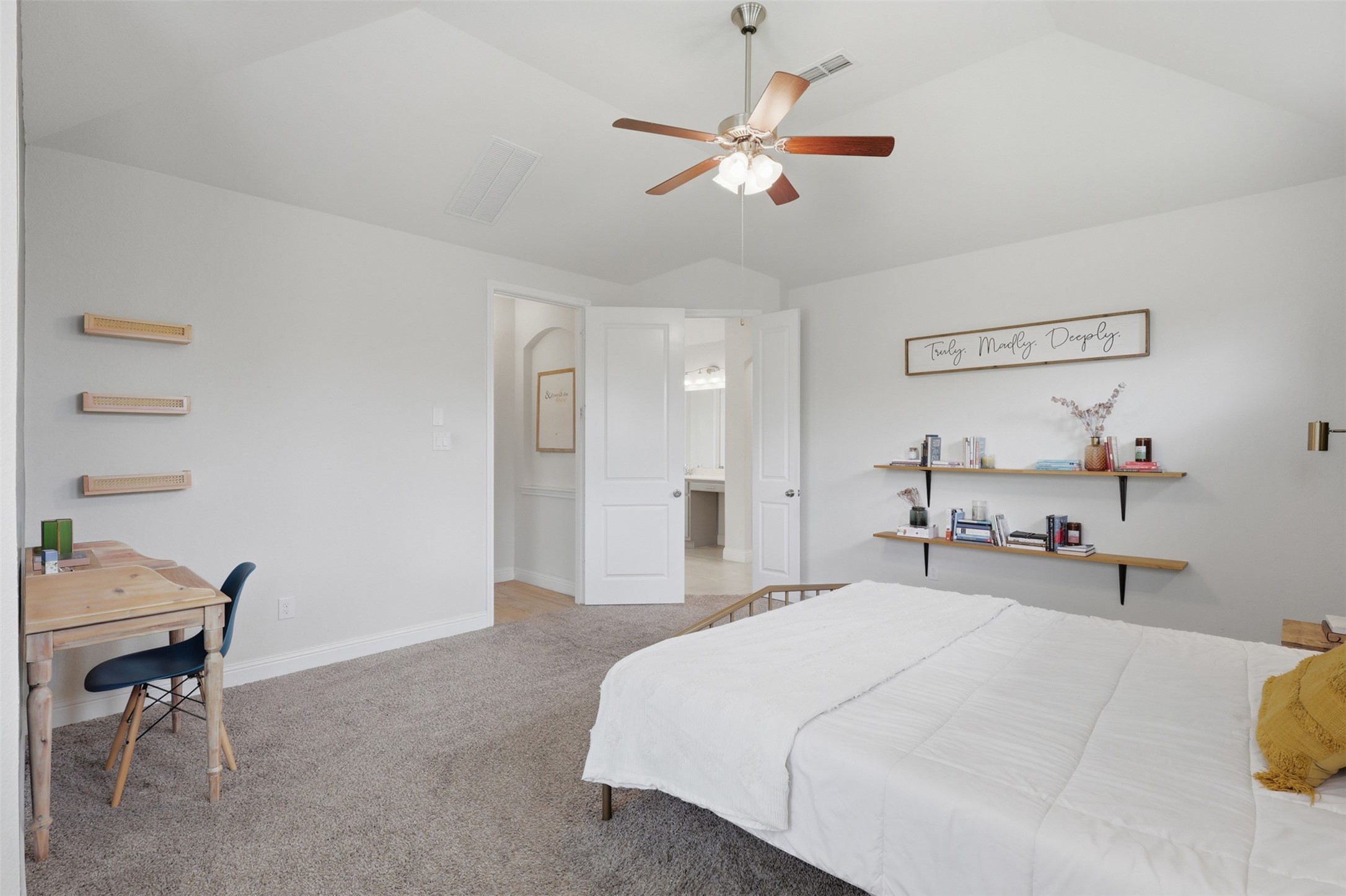 Spacious primary bedroom with room for a sitting area.