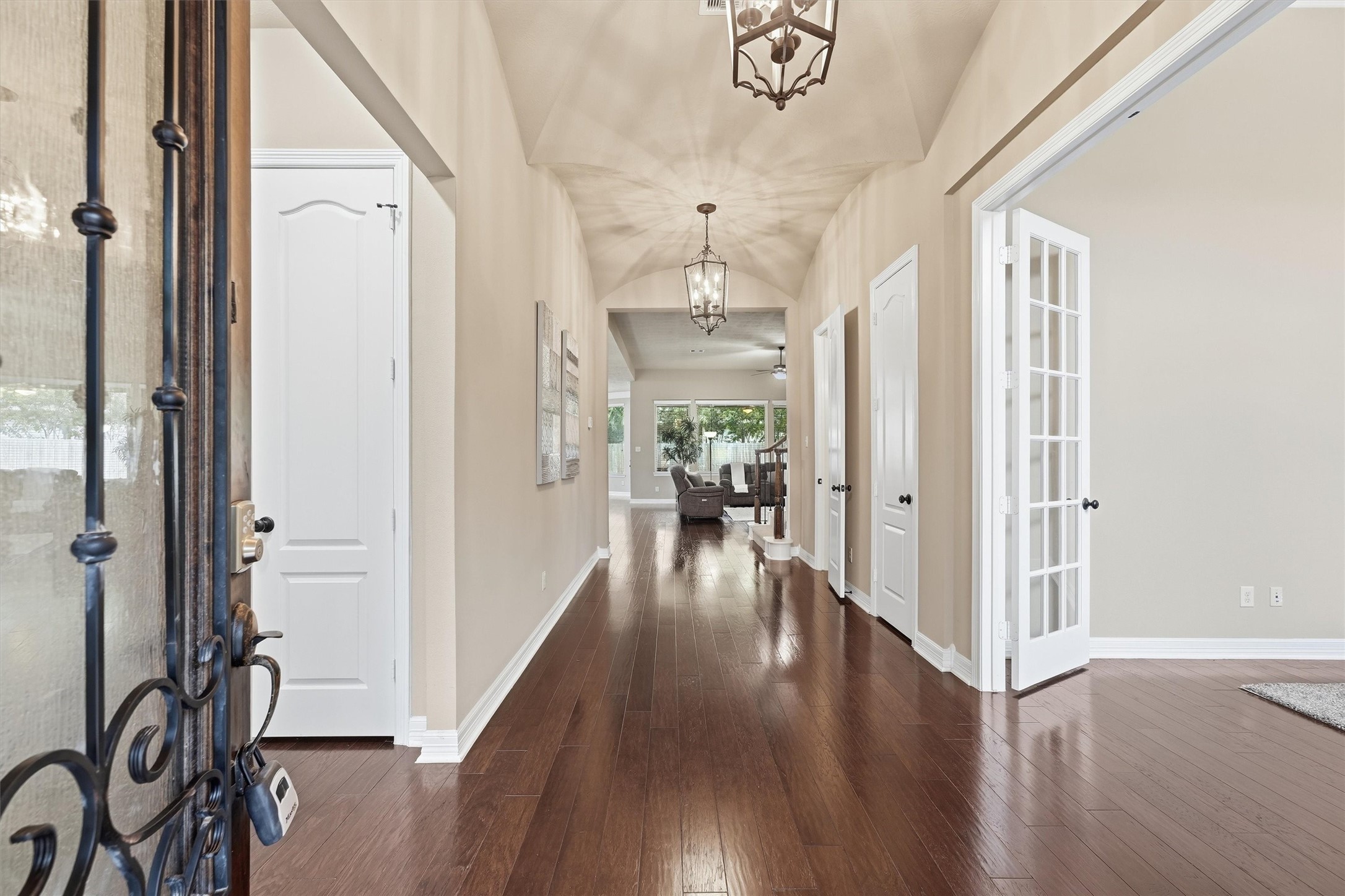 Dramatic barrel-ceiling entry with Private Home Office on right and Hallway to Secondary Bedrooms on Left.