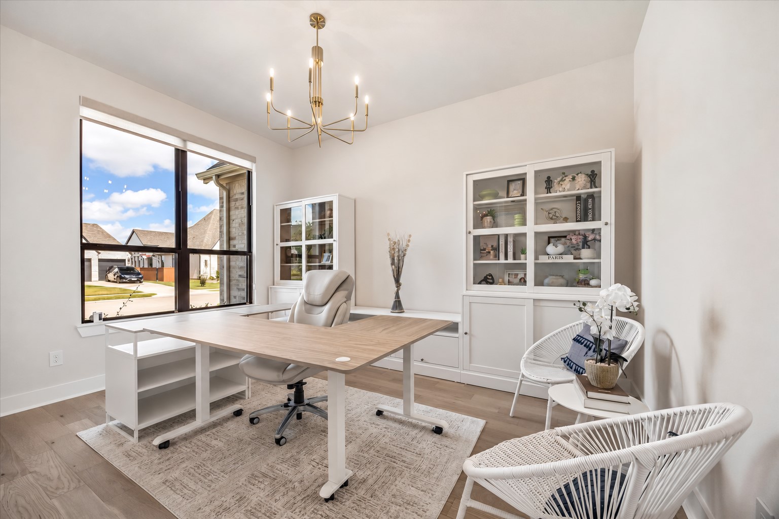 PRIVATE HOME OFFICE OFFERS A LARGE FRONT-FACING WINDOW, WOOD FLOORING, AND PLENTY OF SPACE FOR A FUNCTIONAL WORK-FROM-HOME SETUP. PRIVATE HOME OFFICE OFFERS A LARGE FRONT-FACING WINDOW, WOOD FLOORING, AND PLENTY OF SPACE FOR A FUNCTIONAL WORK-FROM-HOME SETUP.
