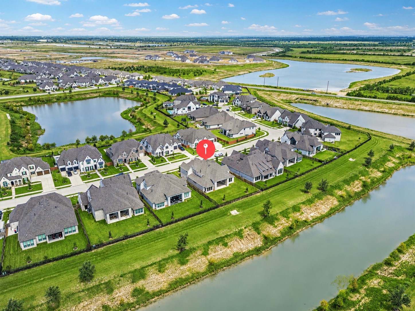 AERIAL VIEW OF 7802 ASHY SUNFLOWER LANE IN ELYSON, HIGHLIGHTING THE HOMES LOCATION NEAR NEIGHBORHOOD LAKES, GREEN SPACE, AND SURROUNDING RESIDENTIAL DEVELOPMENT. AERIAL VIEW OF 7802 ASHY SUNFLOWER LANE IN ELYSON, HIGHLIGHTING THE HOMES LOCATION NEAR NEIGHBORHOOD LAKES, GREEN SPACE, AND SURROUNDING RESIDENTIAL DEVELOPMENT.