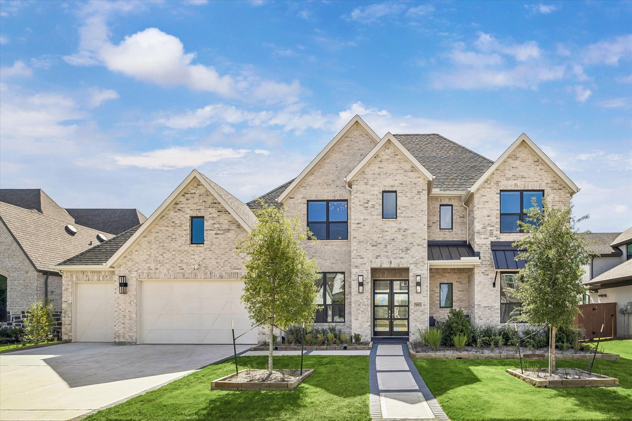 FRONT VIEW SHOWCASES THE LIGHT BRICK EXTERIOR, MODERN BLACK-FRAMED WINDOWS, LANDSCAPED YARD, AND CONTEMPORARY DOUBLE-DOOR ENTRY. FRONT VIEW SHOWCASES THE LIGHT BRICK EXTERIOR, MODERN BLACK-FRAMED WINDOWS, LANDSCAPED YARD, AND CONTEMPORARY DOUBLE-DOOR ENTRY.
