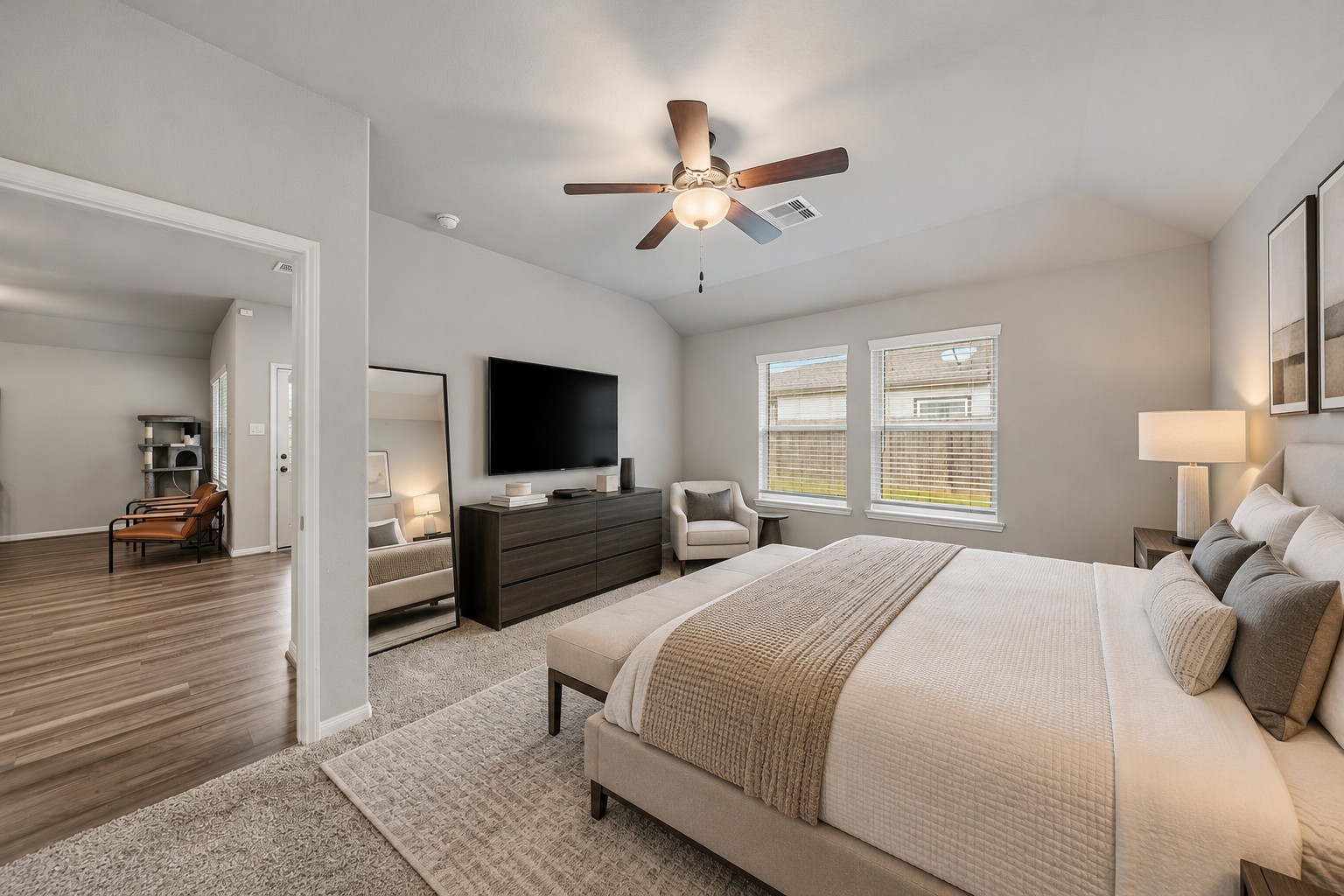 Virtually Staged: This spacious primary bedroom features vaulted ceilings, and plush carpeting that creates a warm, inviting atmosphere. Two large windows allow abundant natural light to fill the space, enhancing its bright and airy feel. Virtually Staged: This spacious primary bedroom features vaulted ceilings, and plush carpeting that creates a warm, inviting atmosphere. Two large windows allow abundant natural light to fill the space, enhancing its bright and airy feel.