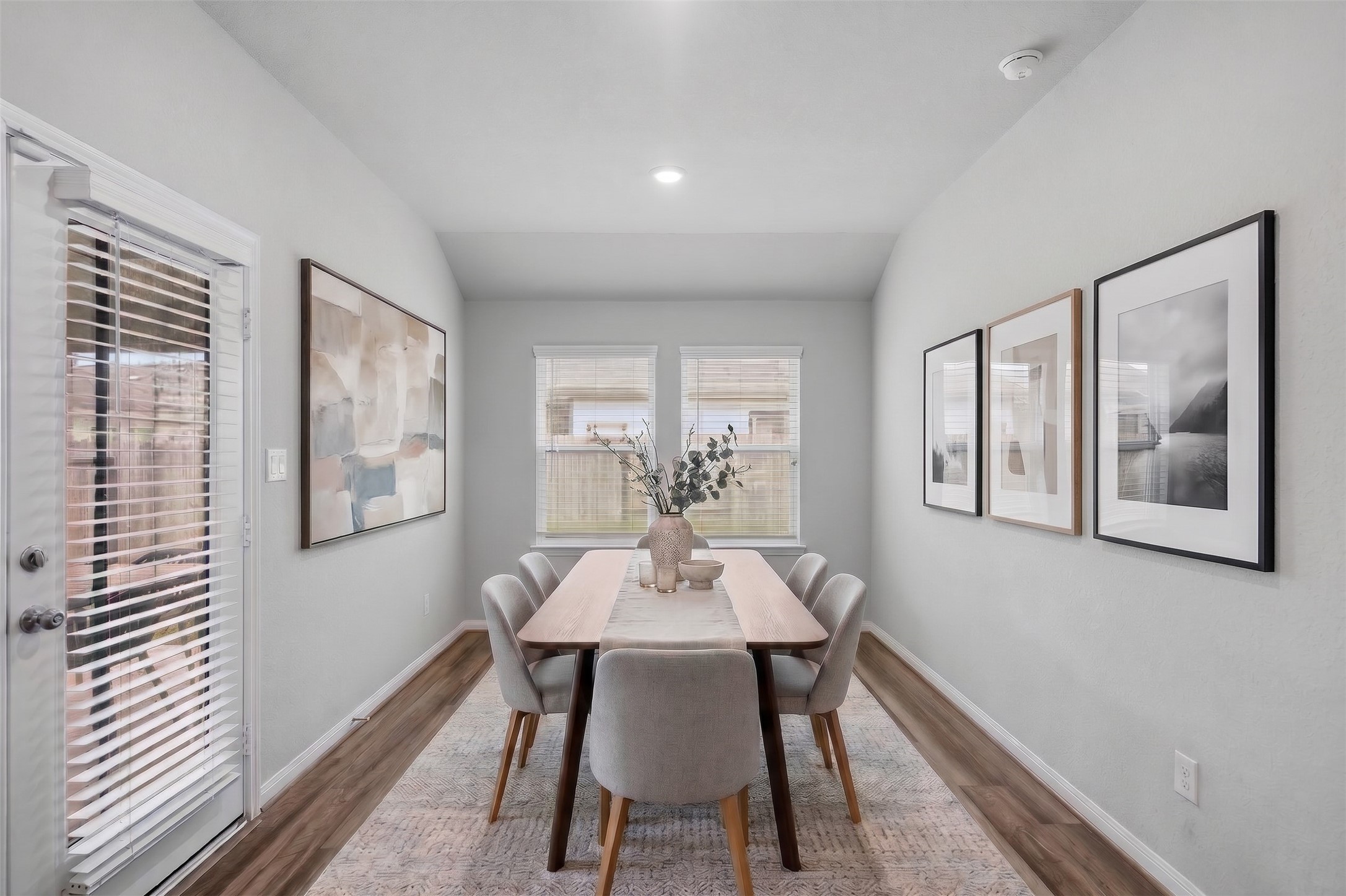 Virtually Staged: This bright and inviting dining area features soft neutral walls, attractive flooring, and crisp white baseboards. Two large windows allow abundant natural light to fill the space, while a glass-paneled exterior door provides convenient access to the covered patio and backyard. Virtually Staged: This bright and inviting dining area features soft neutral walls, attractive flooring, and crisp white baseboards. Two large windows allow abundant natural light to fill the space, while a glass-paneled exterior door provides convenient access to the covered patio and backyard.