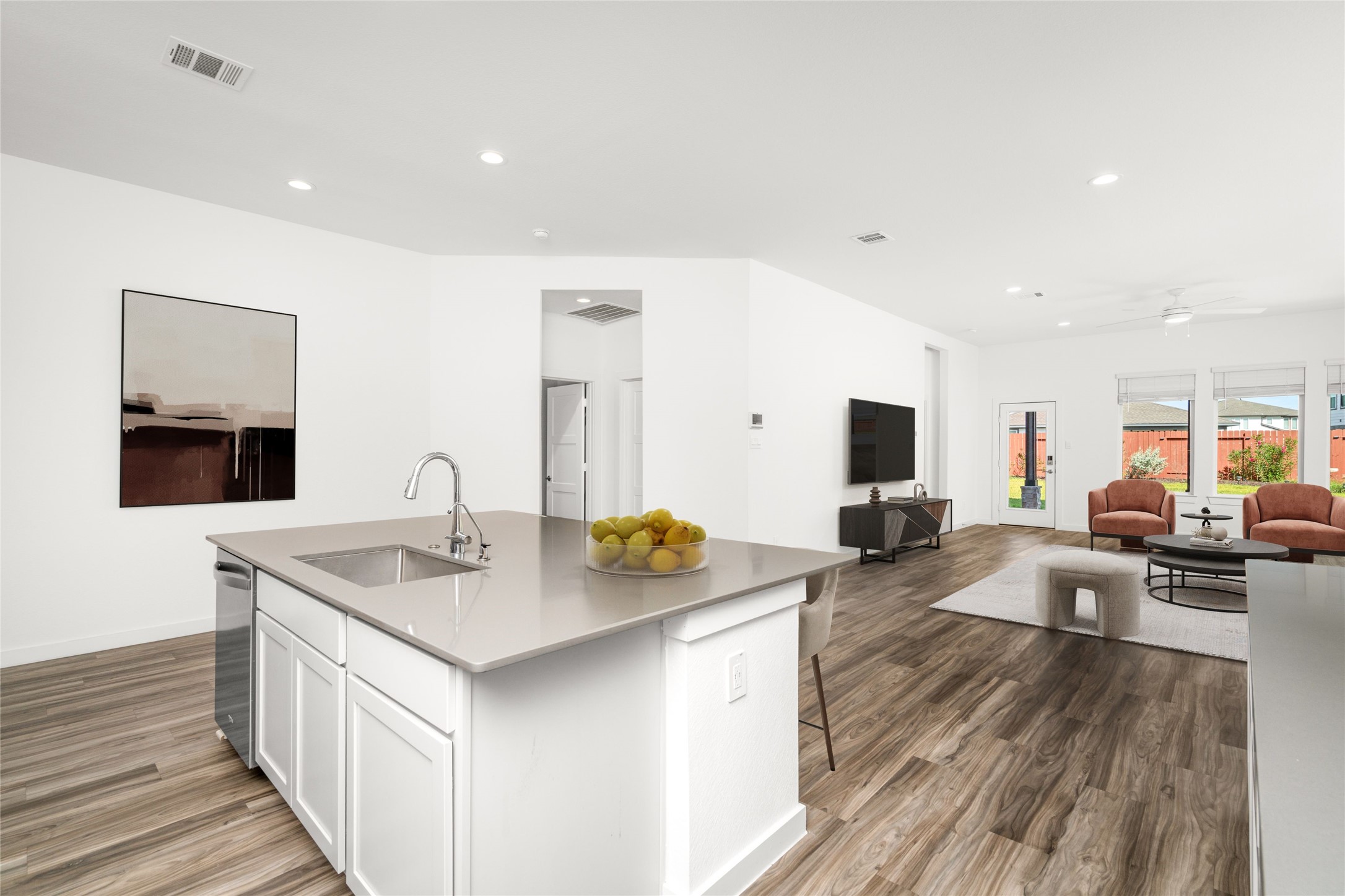 Open concept living, dining, and kitchen. Picture has been virtually staged.