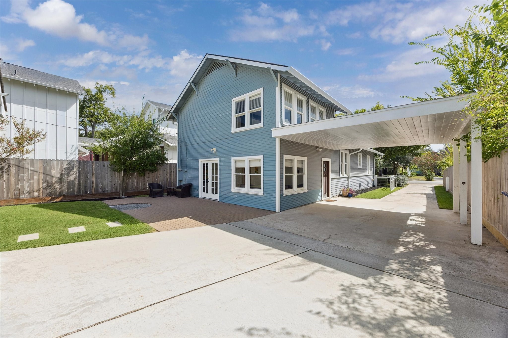 Long driveway with carport adding more covered parking