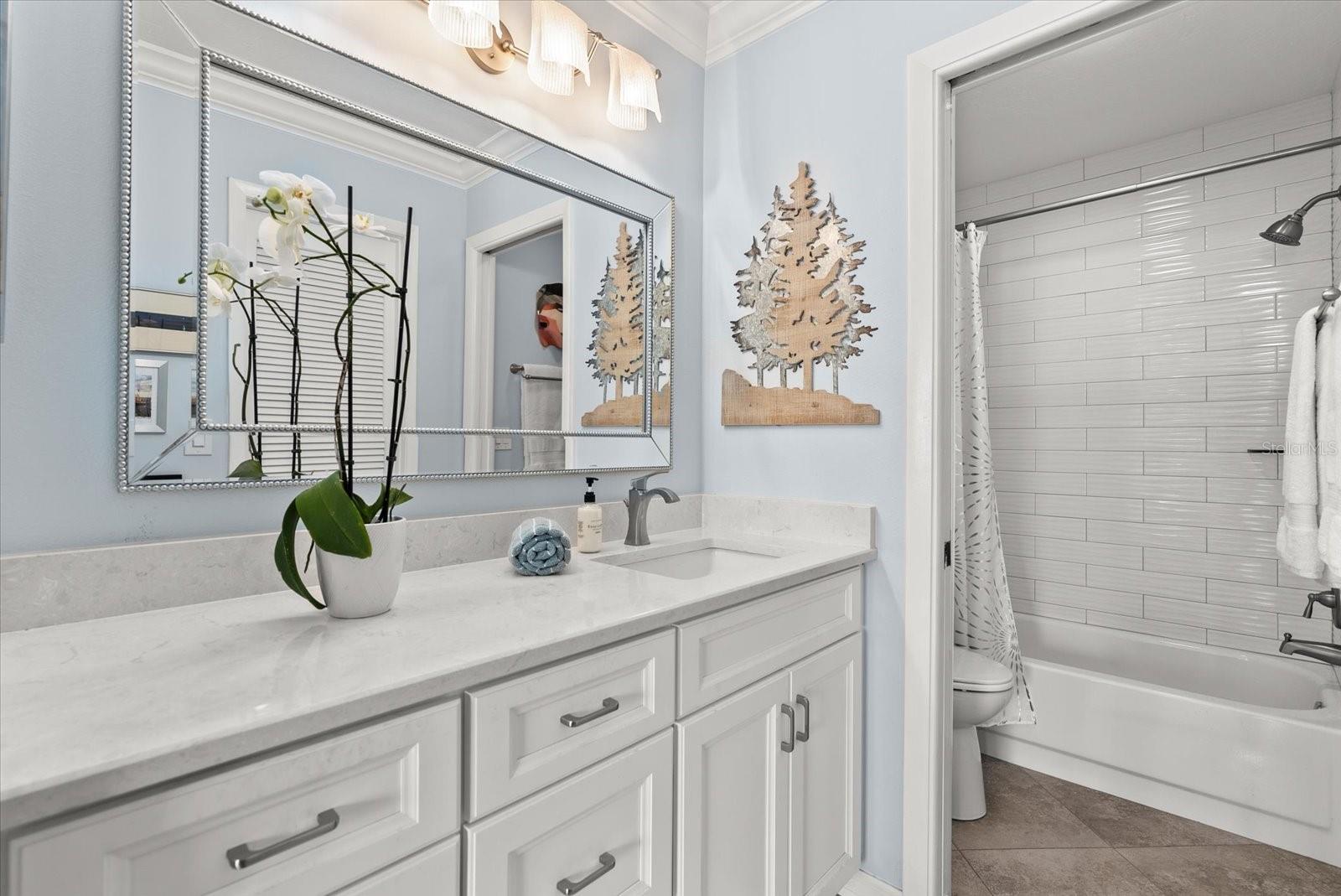 New Primary Bathroom with custom tile work.