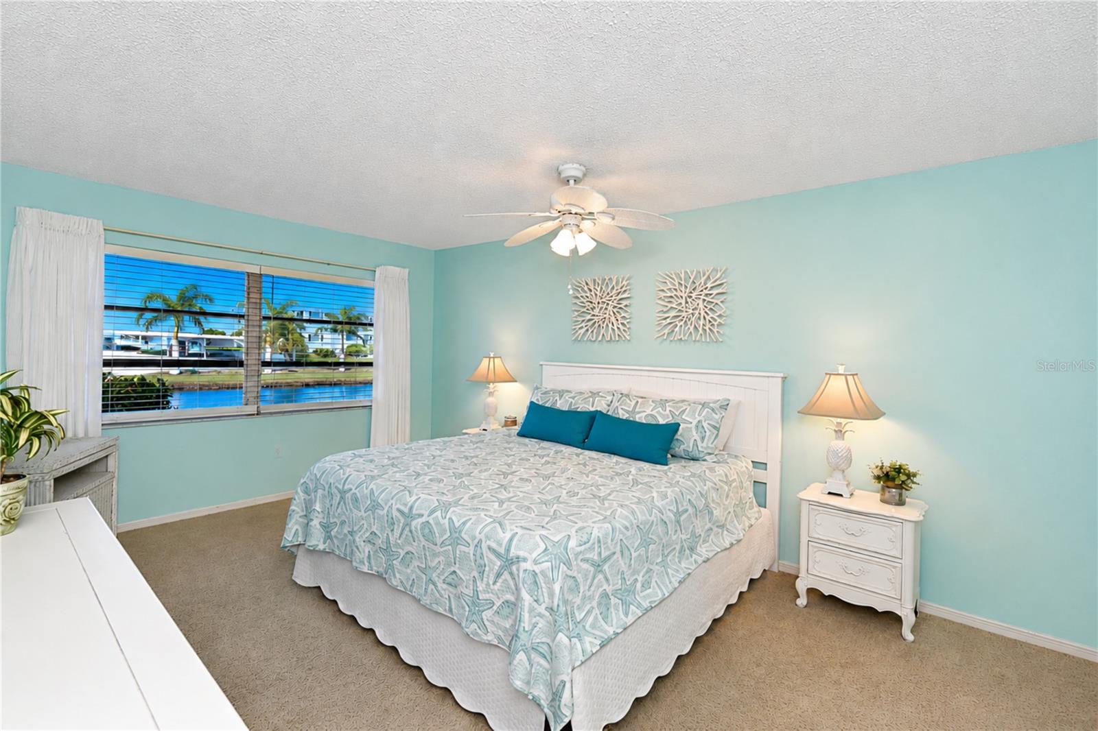 Primary bedroom with view of water