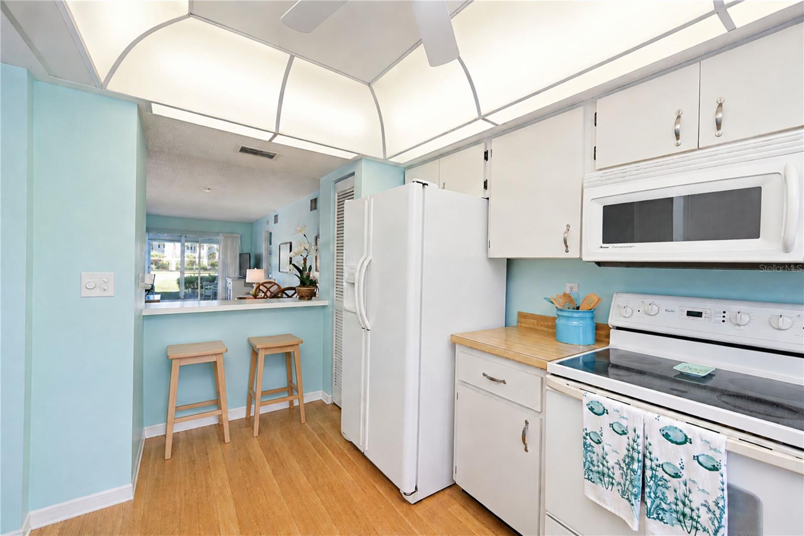Kitchen from sink over breakfast bar