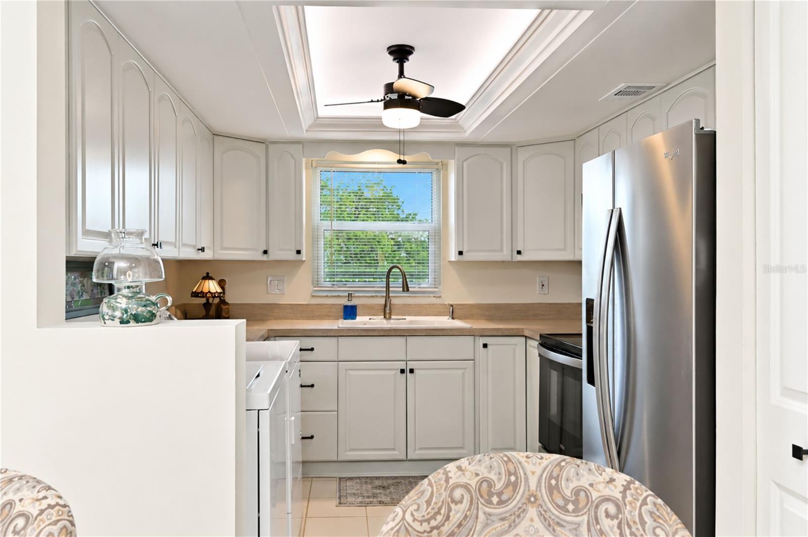 Kitchen features a stainless appliance suite