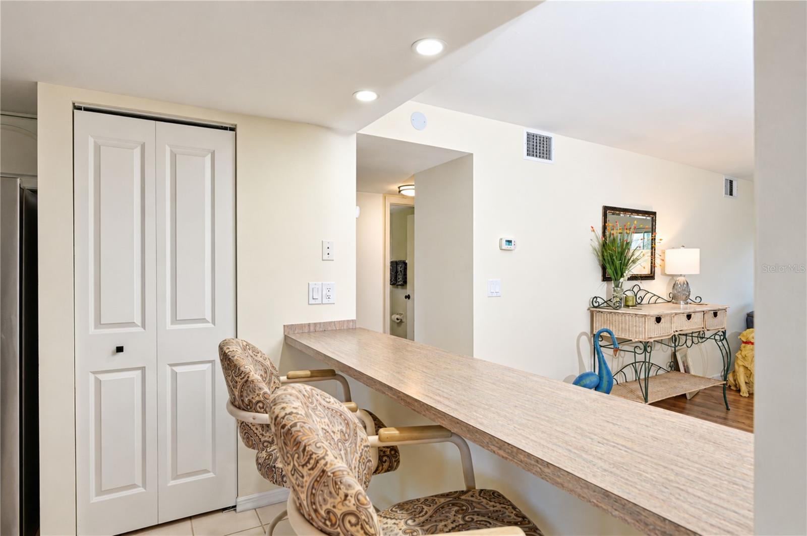 Breakfast bar and closet pantry are so convenient