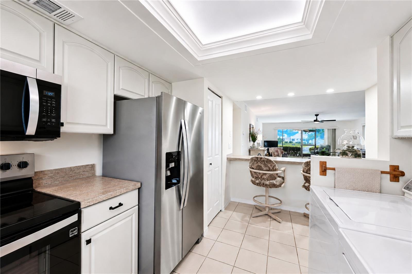 View from kitchen extends through the entertaining areas to the outdoors