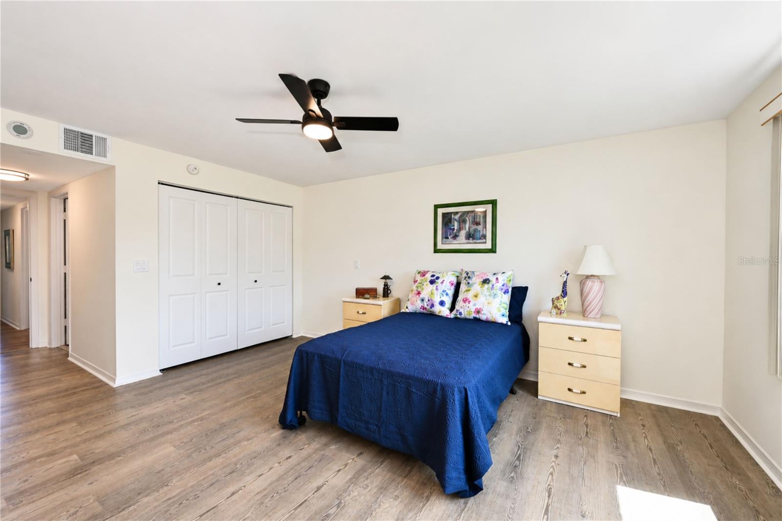Primary bedroom has dual closets, one seen here and one across from the ensuite bathroom