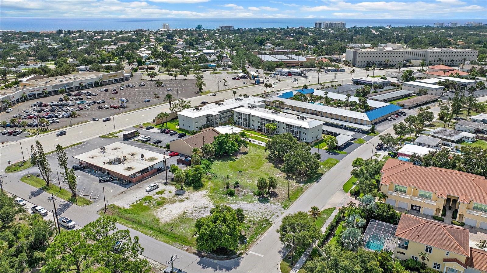 Aerial view of the lot with waterfront high-rises visible in the distance