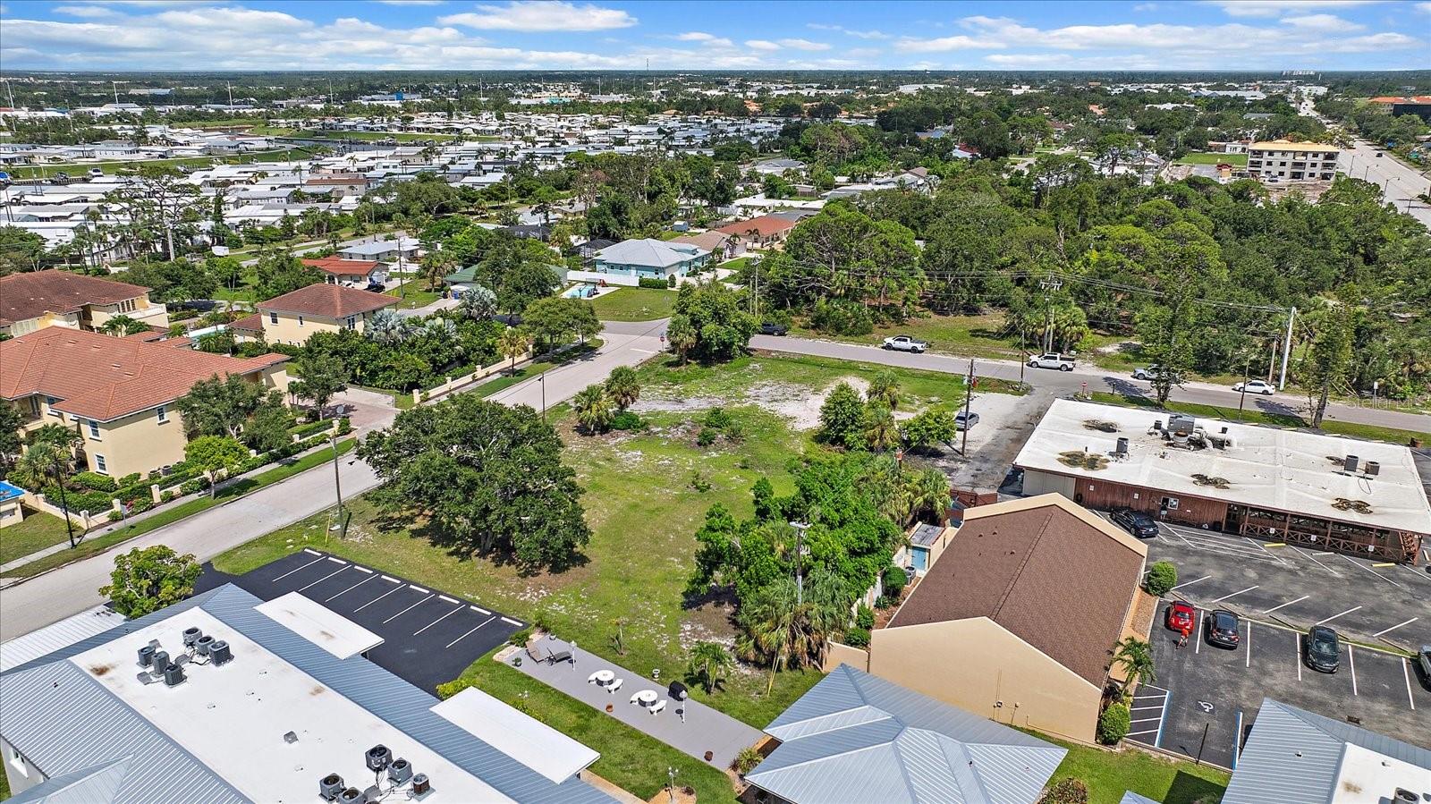 Aerial view of the lot overlooking the surrounding residential neighborhood Aerial view of the lot overlooking the surrounding residential neighborhood