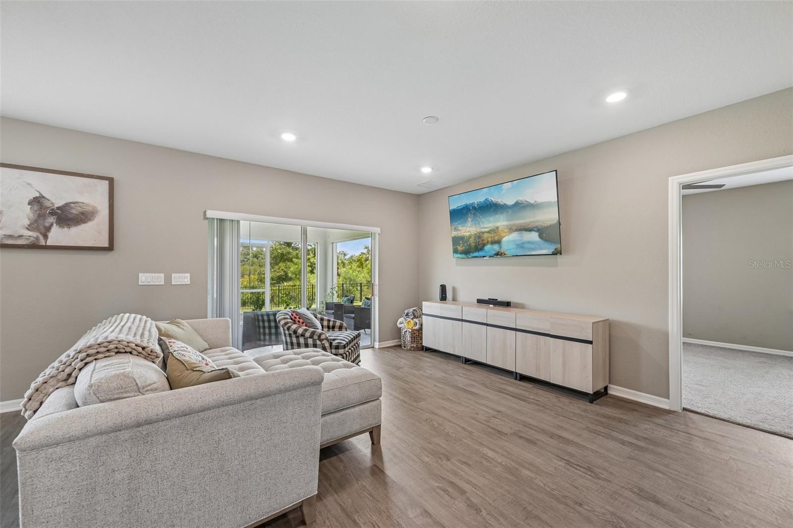 rear living room leading to owners suite